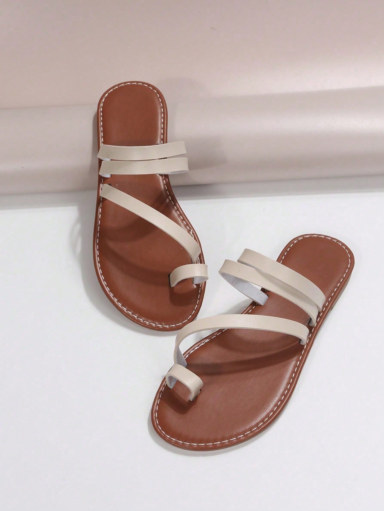 Plus size women's flat slide sandals featuring a toe post and hollow out design, casual outdoor vacation style summer footwear.