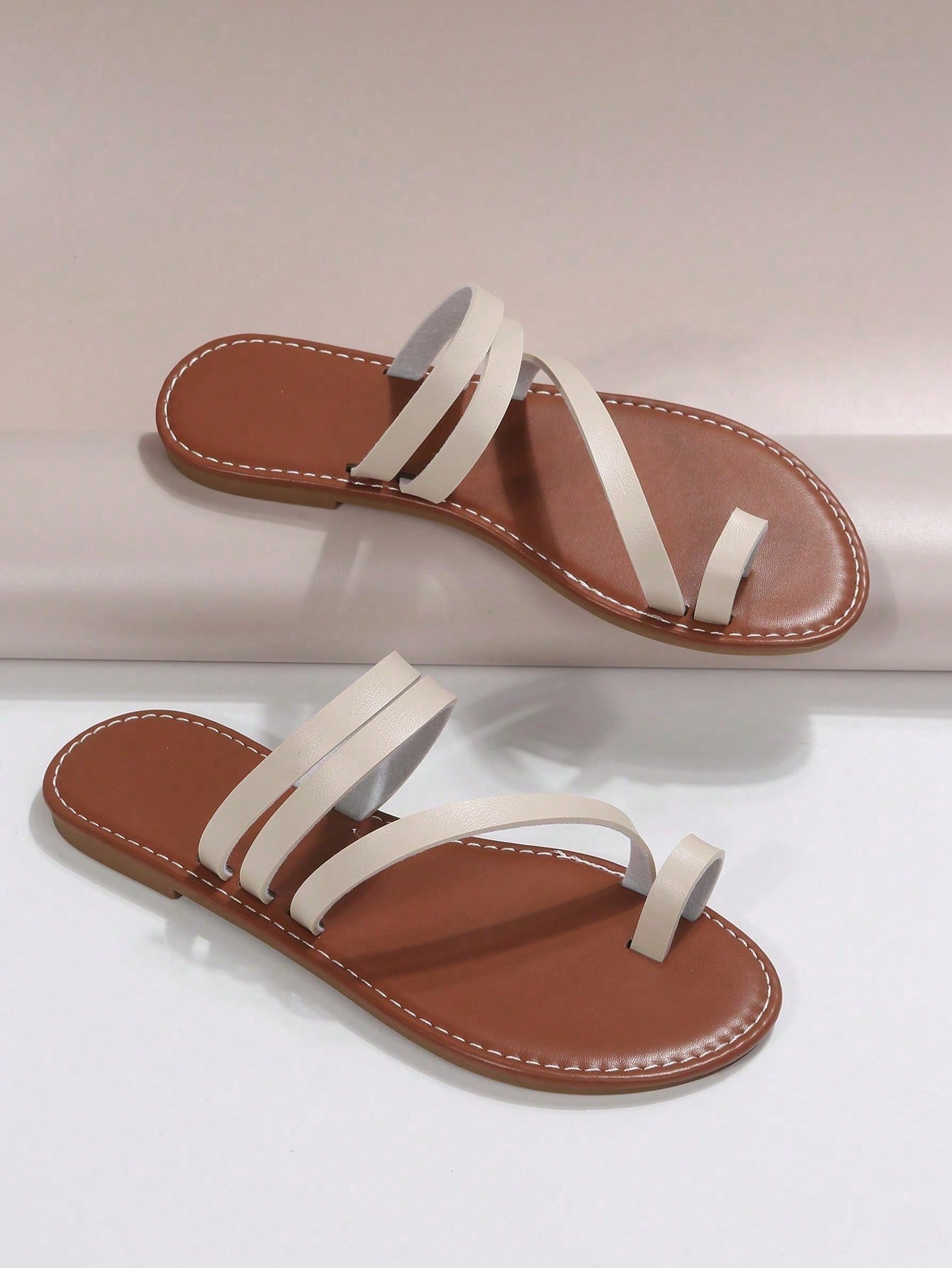 Plus size women's flat slide sandals featuring a toe post and hollow out design, casual outdoor vacation style summer footwear.