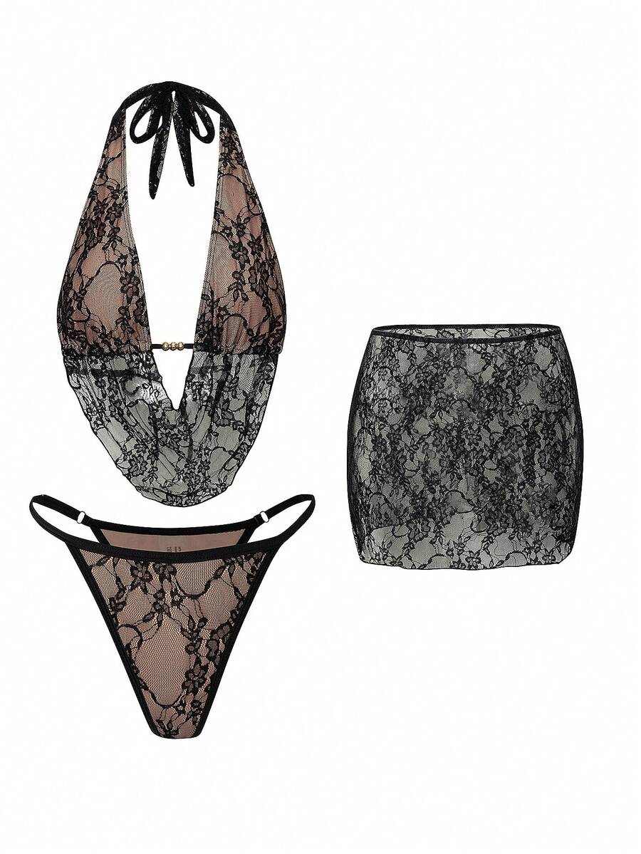 Women's black 3-piece bikini set with halter triangle top, backless design, ruched thong bottoms, and matching lace skirt for beach or vacation wear.