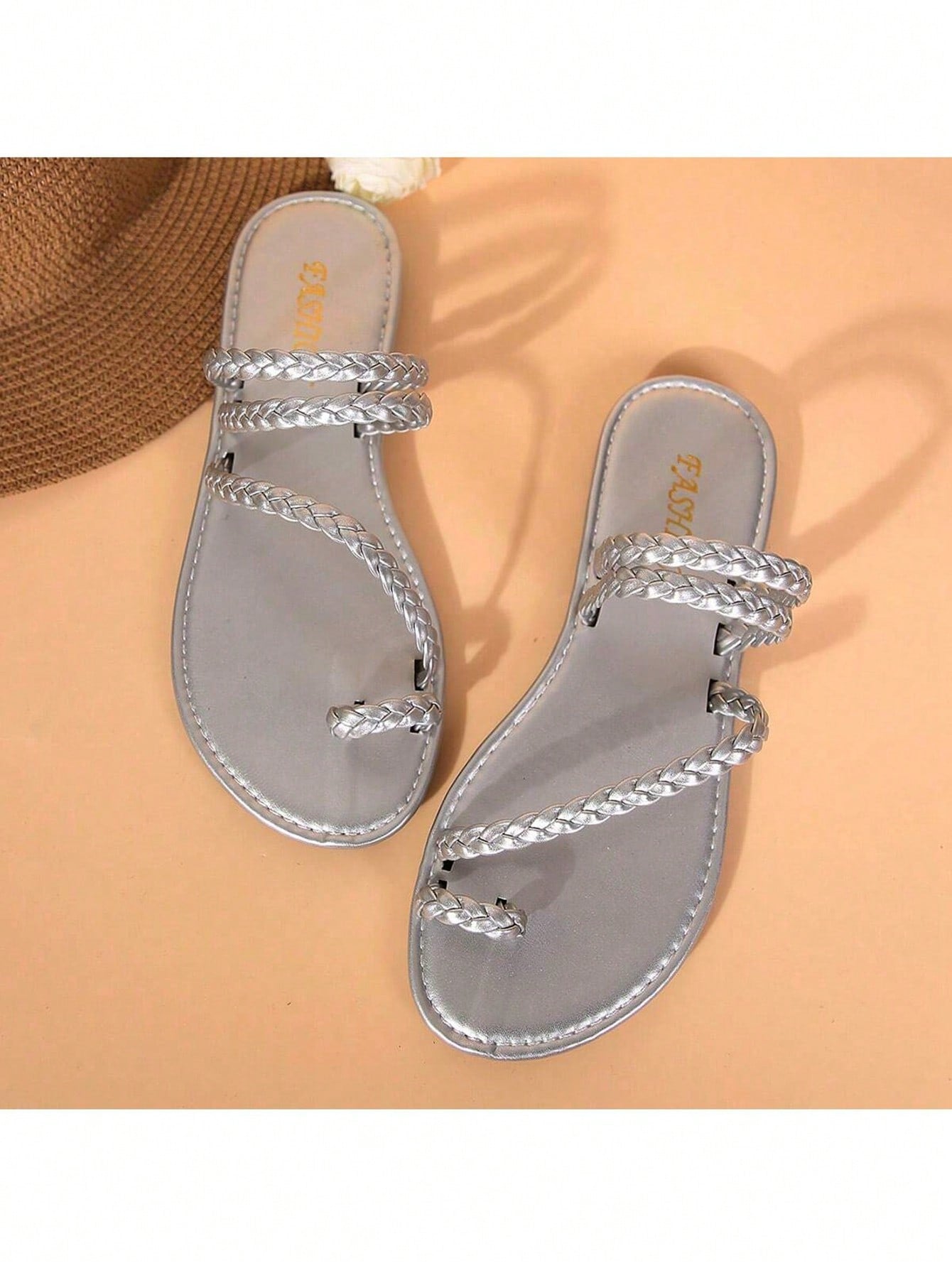 Plus size women's flat slide sandals with woven braid detail and open toe, casual outdoor beach and vacation style.
