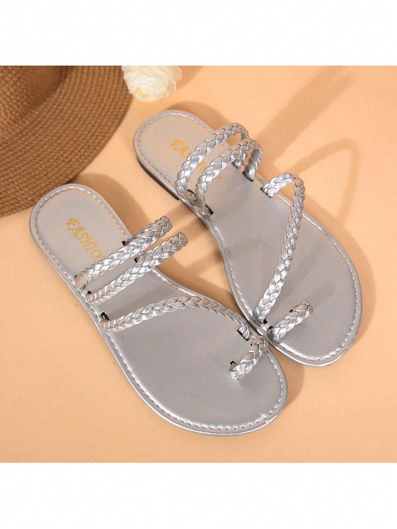 Plus size women's flat slide sandals with woven braid detail and open toe, casual outdoor beach and vacation style.
