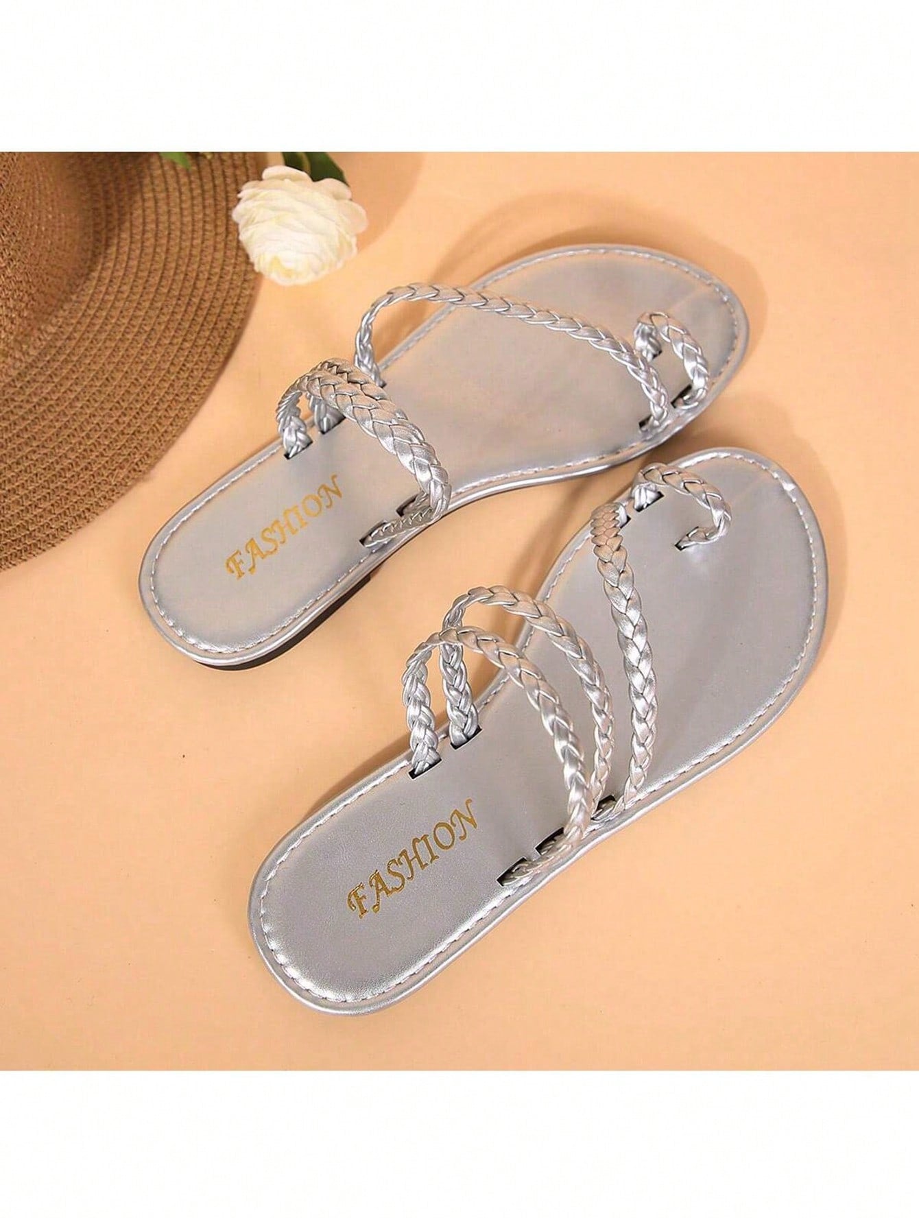 Plus size women's flat slide sandals with woven braid detail and open toe, casual outdoor beach and vacation style.