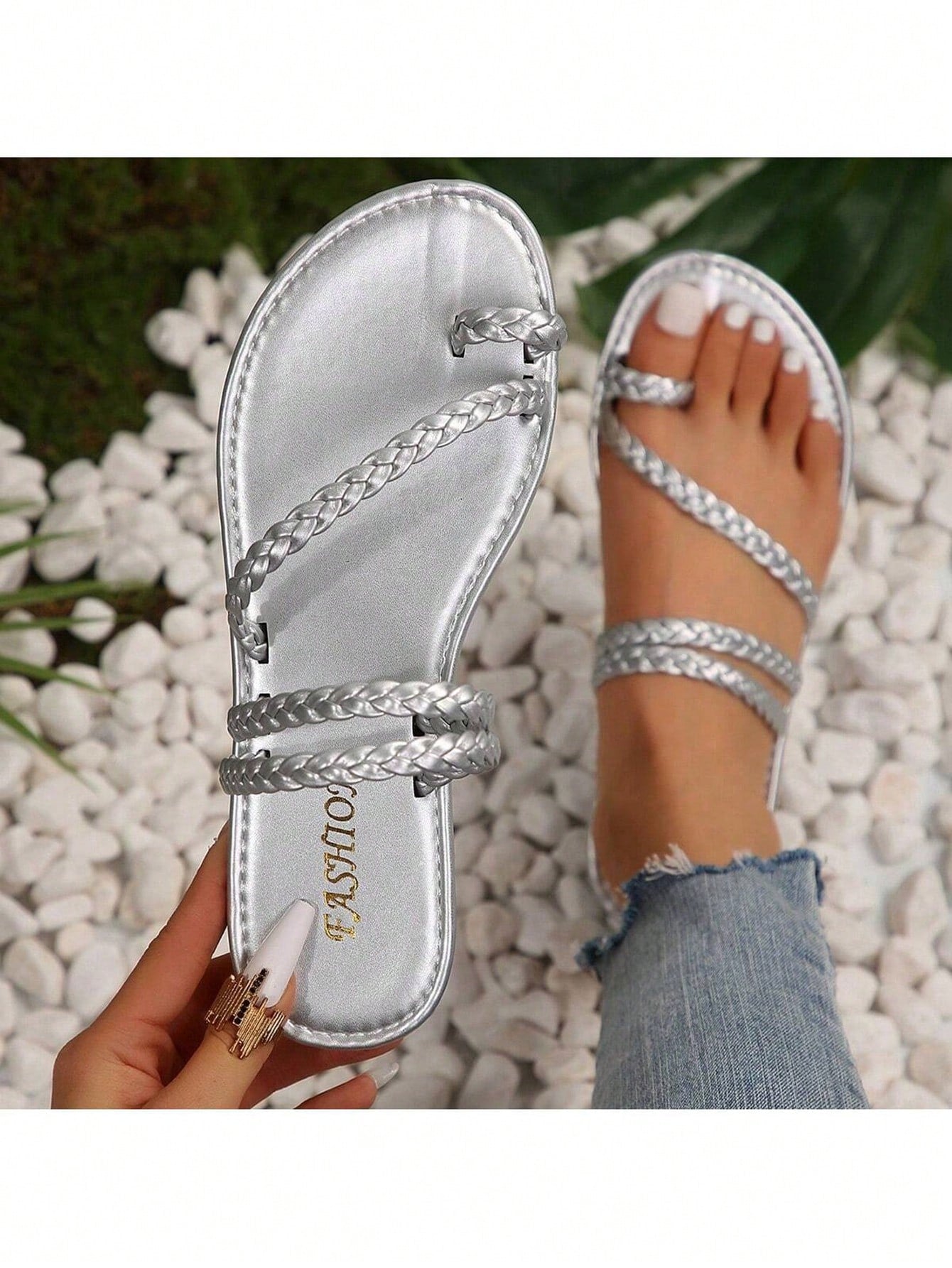 Plus size women's flat slide sandals with woven braid detail and open toe, casual outdoor beach and vacation style.