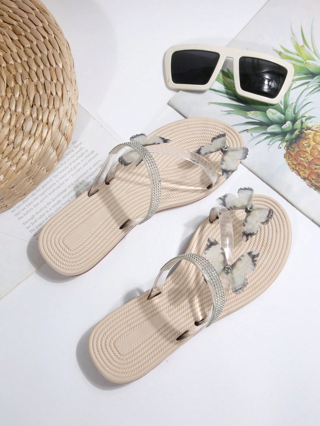 Women's open-toe strappy flat sandals with tasseled upper, seashell-inspired decoration, and rhinestone detail, designed for lightweight, comfortable beach and casual indoor or outdoor wear.