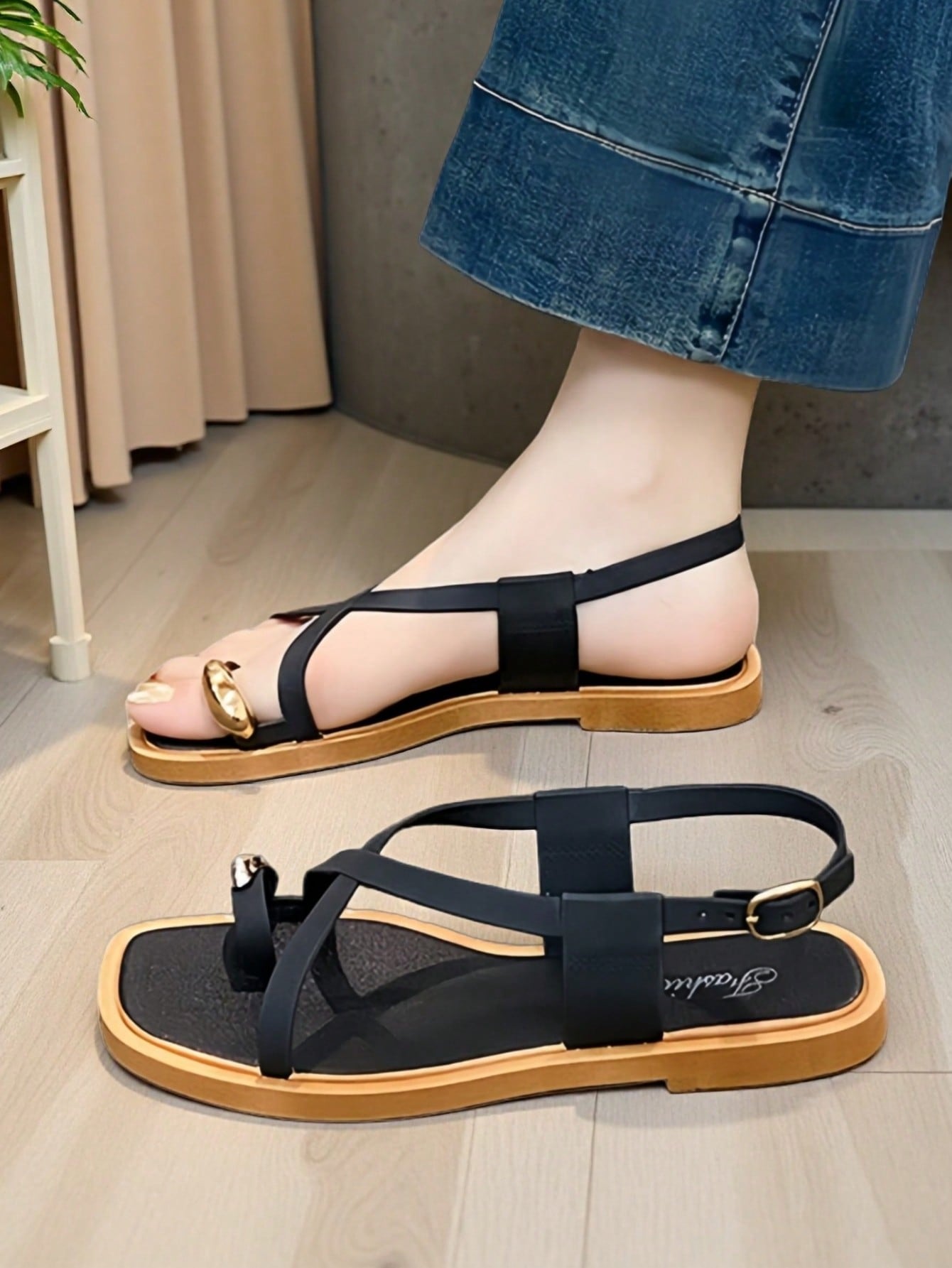 Women's white flat slide sandals featuring criss cross straps, shell detail, and buckle accents