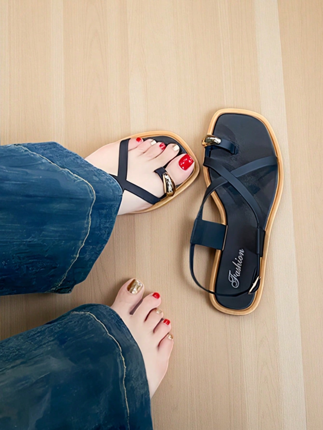 Women's white flat slide sandals featuring criss cross straps, shell detail, and buckle accents