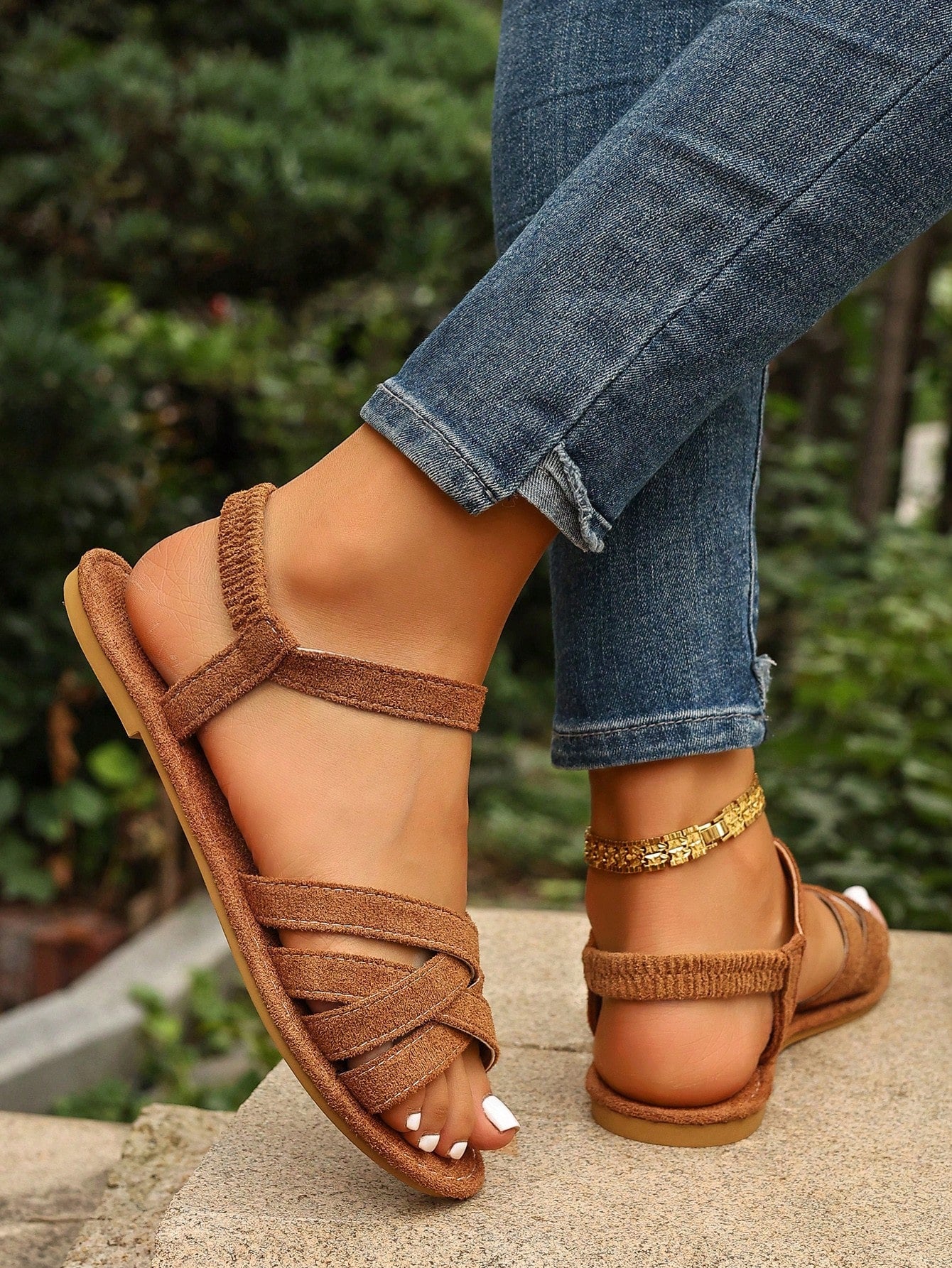 Women's flat thick sole gladiator sandals with cross adjustable straps and open toe, suitable for casual, vacation, and beach wear.