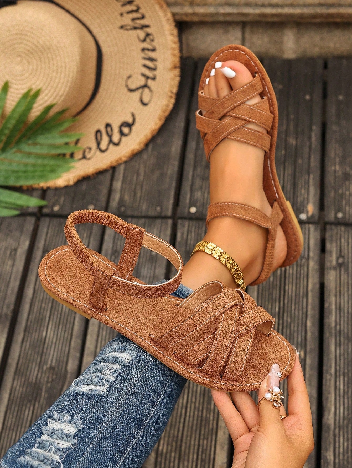 Women's flat thick sole gladiator sandals with cross adjustable straps and open toe, suitable for casual, vacation, and beach wear.
