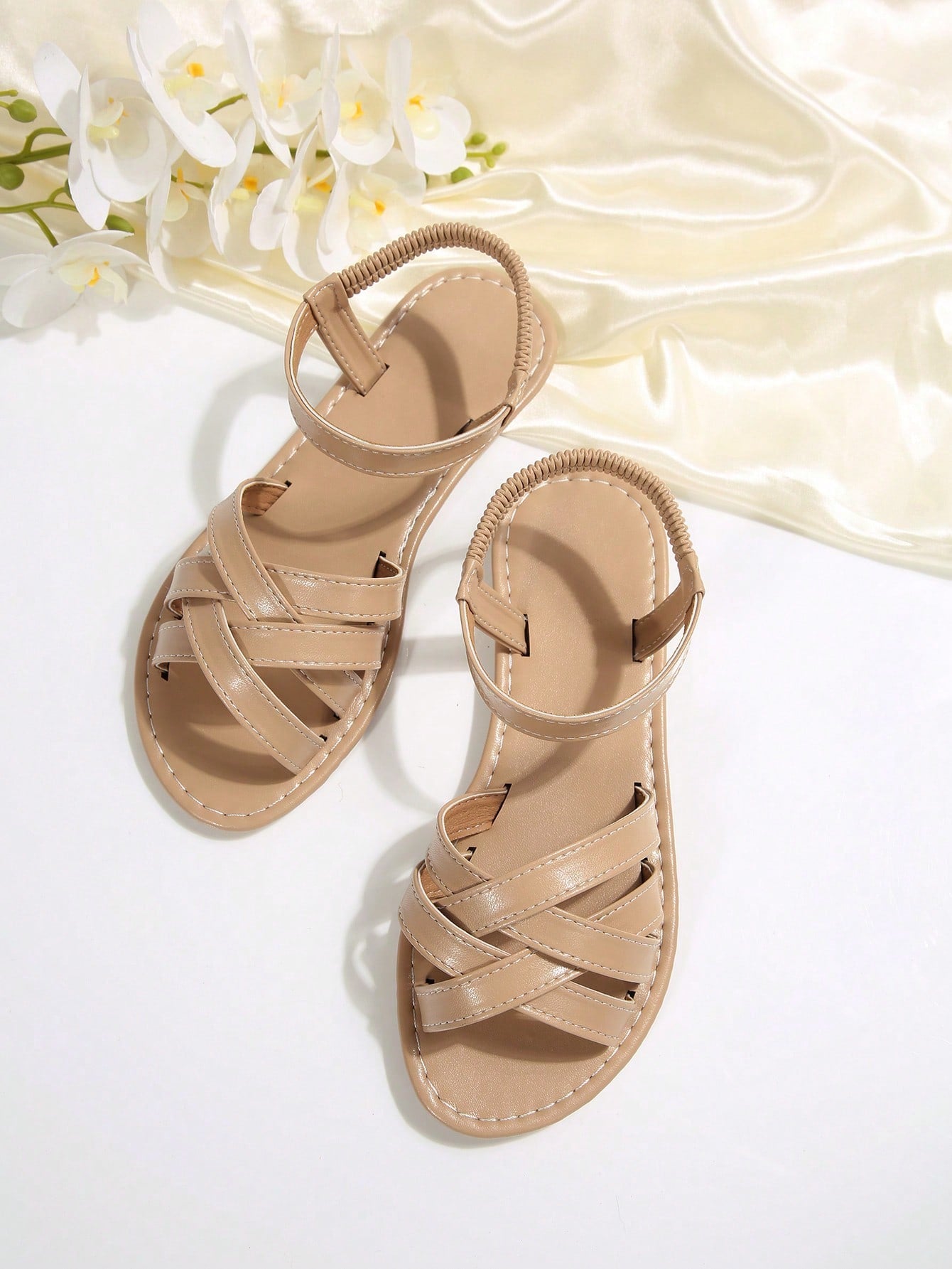 Women's flat thick sole gladiator sandals with cross adjustable straps and open toe, suitable for casual, vacation, and beach wear.