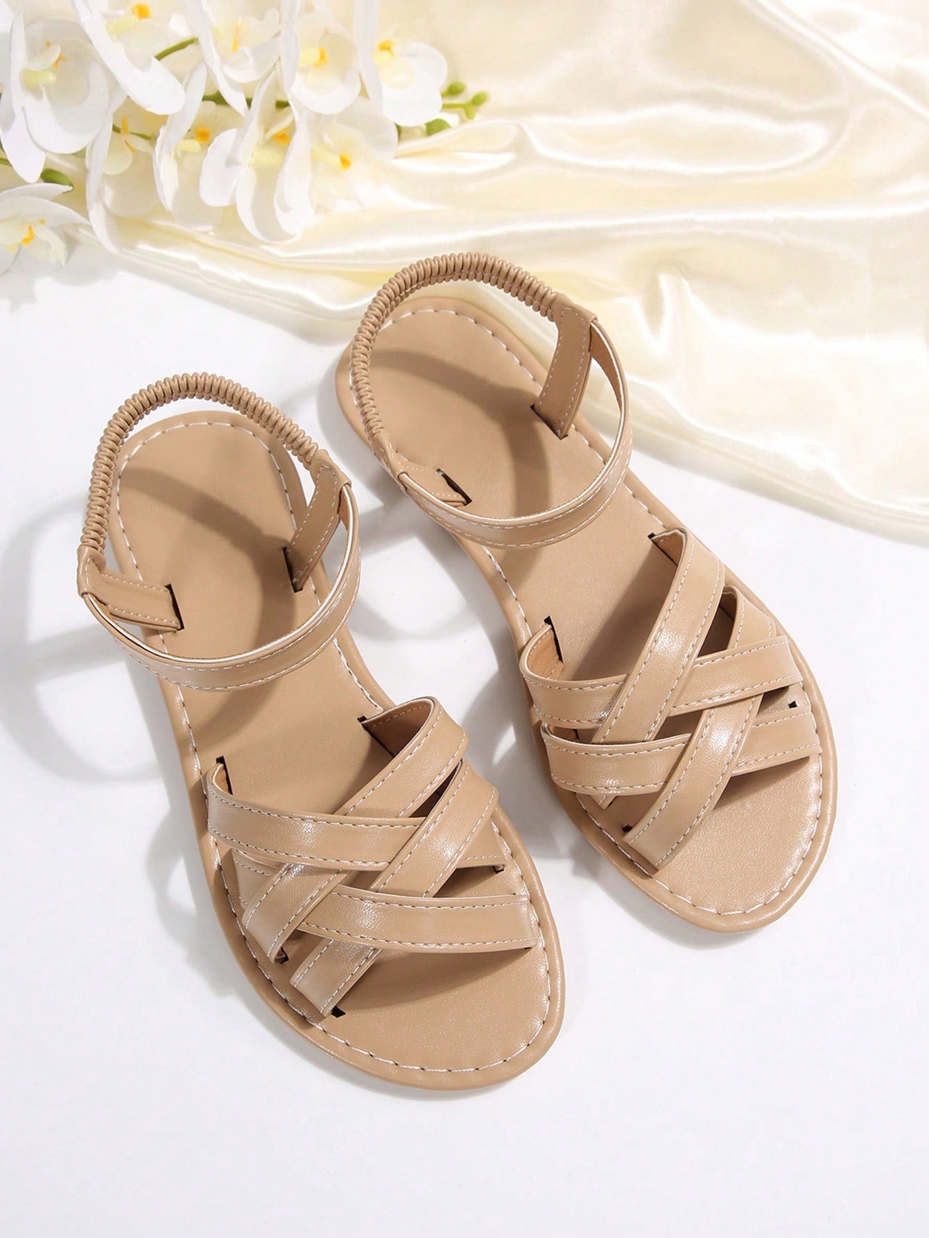 Women's flat thick sole gladiator sandals with cross adjustable straps and open toe, suitable for casual, vacation, and beach wear.