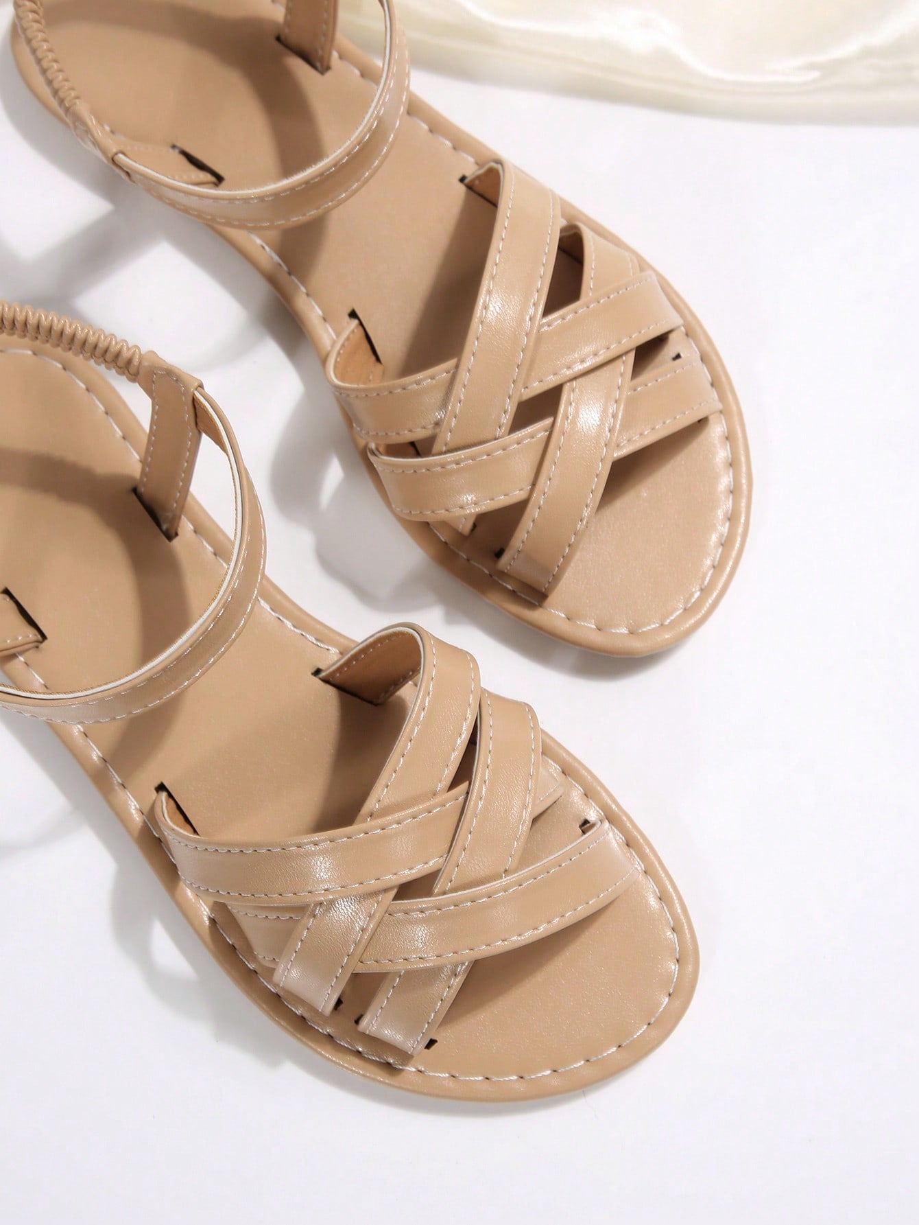 Women's flat thick sole gladiator sandals with cross adjustable straps and open toe, suitable for casual, vacation, and beach wear.