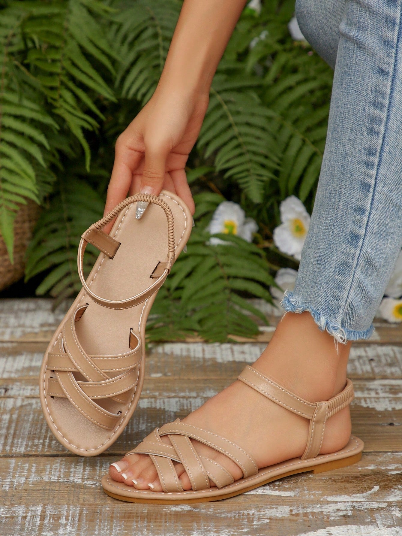 Women's flat thick sole gladiator sandals with cross adjustable straps and open toe, suitable for casual, vacation, and beach wear.