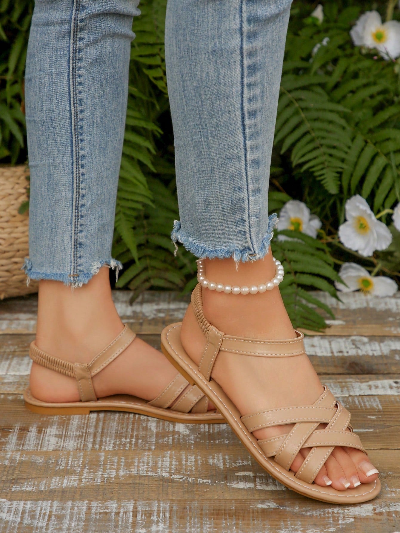 Women's flat thick sole gladiator sandals with cross adjustable straps and open toe, suitable for casual, vacation, and beach wear.