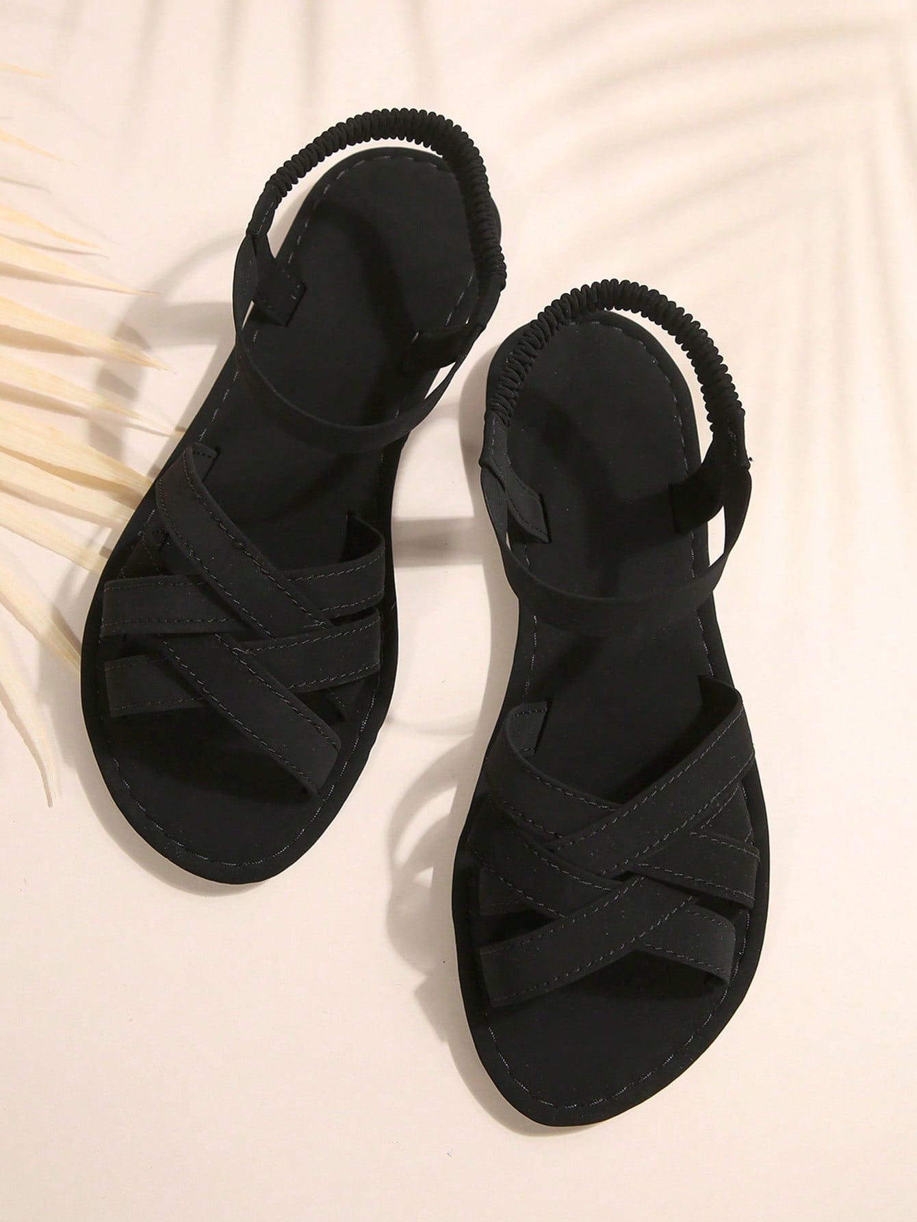 Women's flat thick sole gladiator sandals with cross adjustable straps and open toe, suitable for casual, vacation, and beach wear.