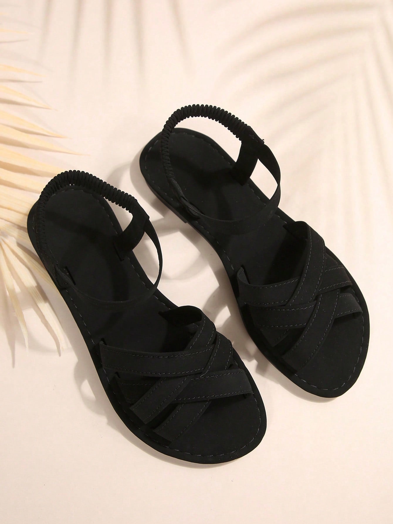 Women's flat thick sole gladiator sandals with cross adjustable straps and open toe, suitable for casual, vacation, and beach wear.