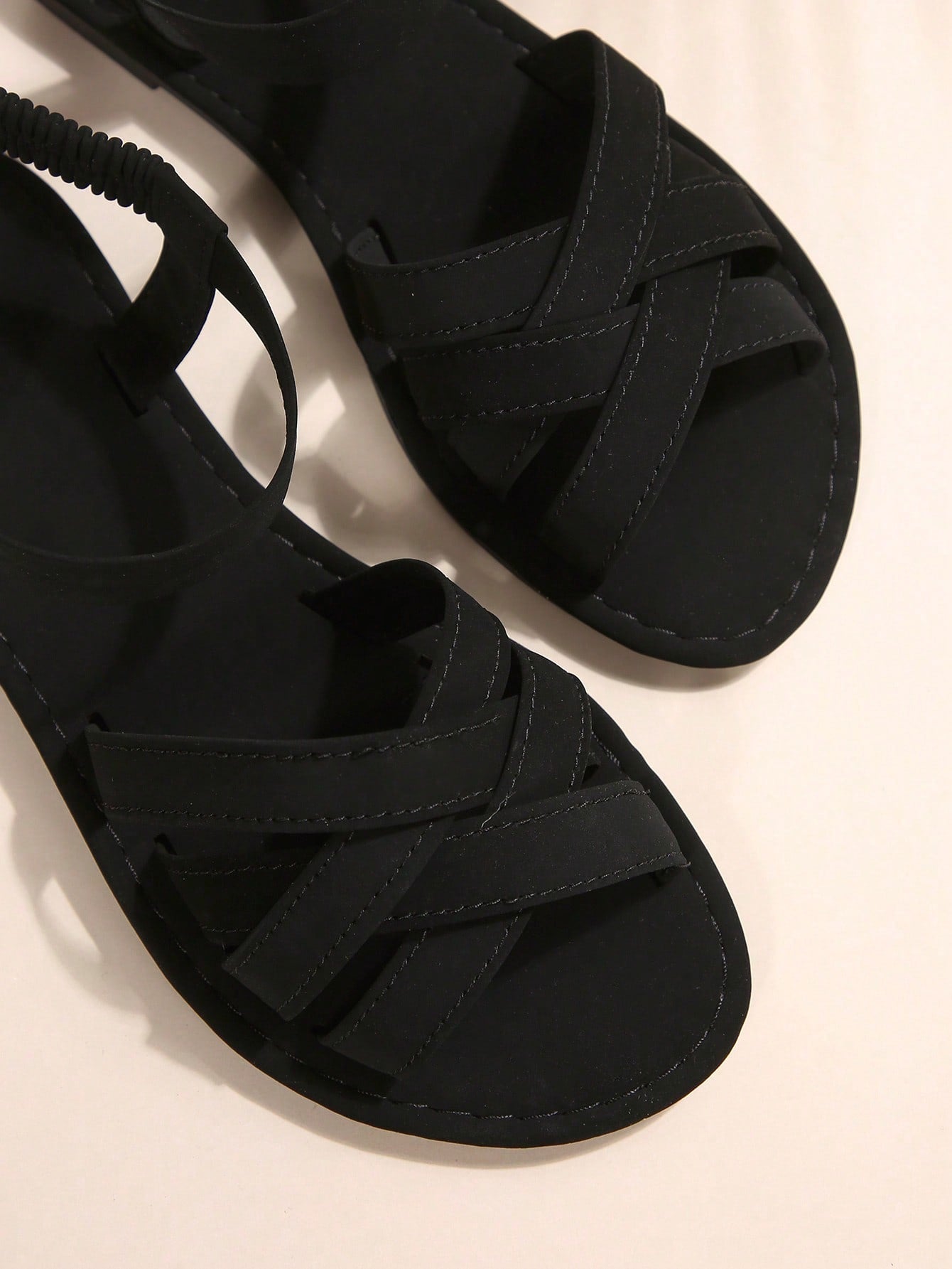 Women's flat thick sole gladiator sandals with cross adjustable straps and open toe, suitable for casual, vacation, and beach wear.