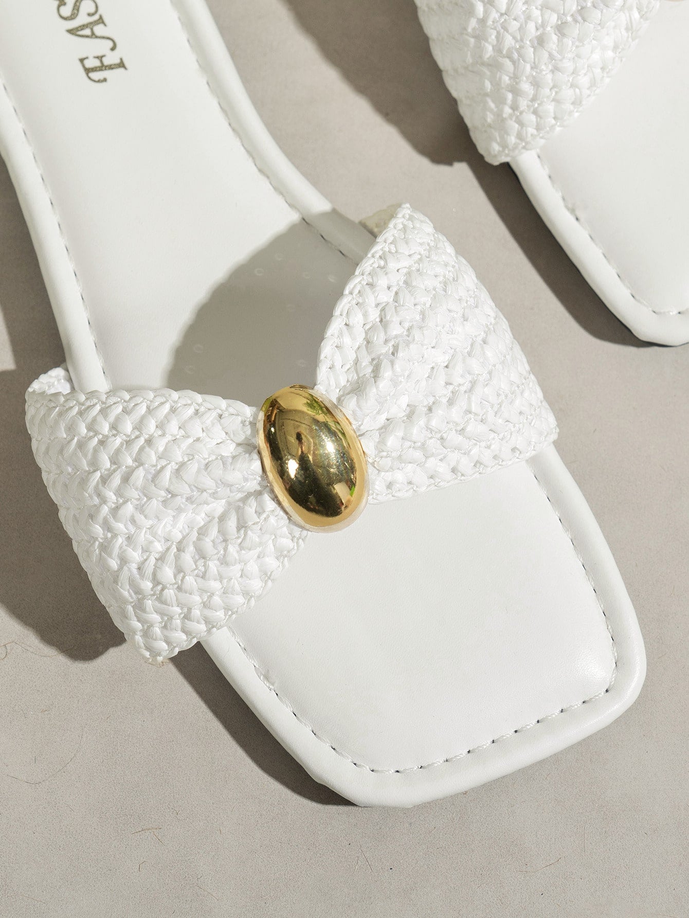 Women's ginger woven flat slide sandals with open toe, bow knot detail, and metal decor in a minimalist beach style.