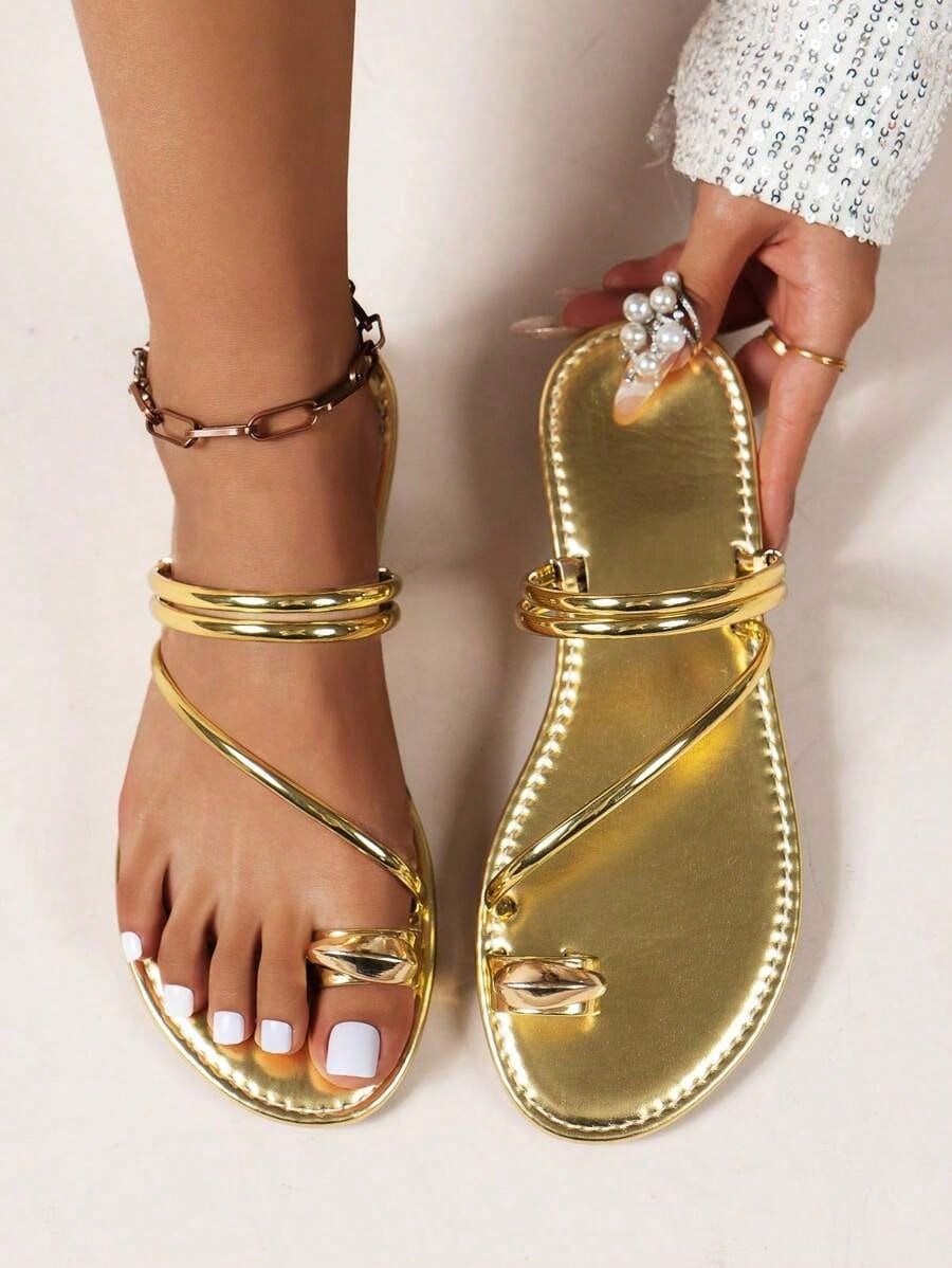 Women's leopard braided flat thong sandals with toe post and metal detail, designed for beach and vacation casual wear.