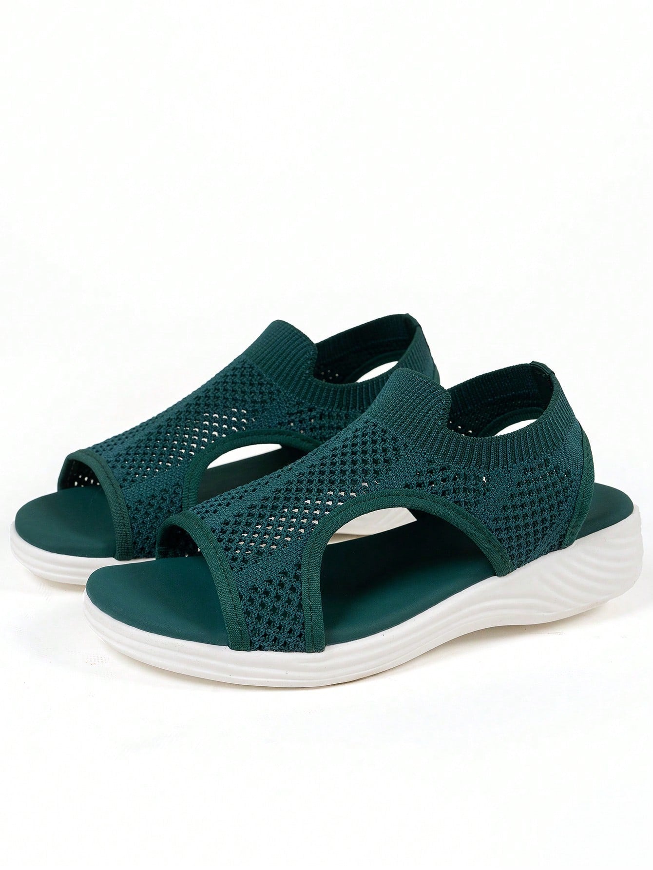 Plus size women's slip-on wedge slide sandals with open toe, low platform heel, and breathable cutout fabric upper, shown as a casual outdoor style sandal.
