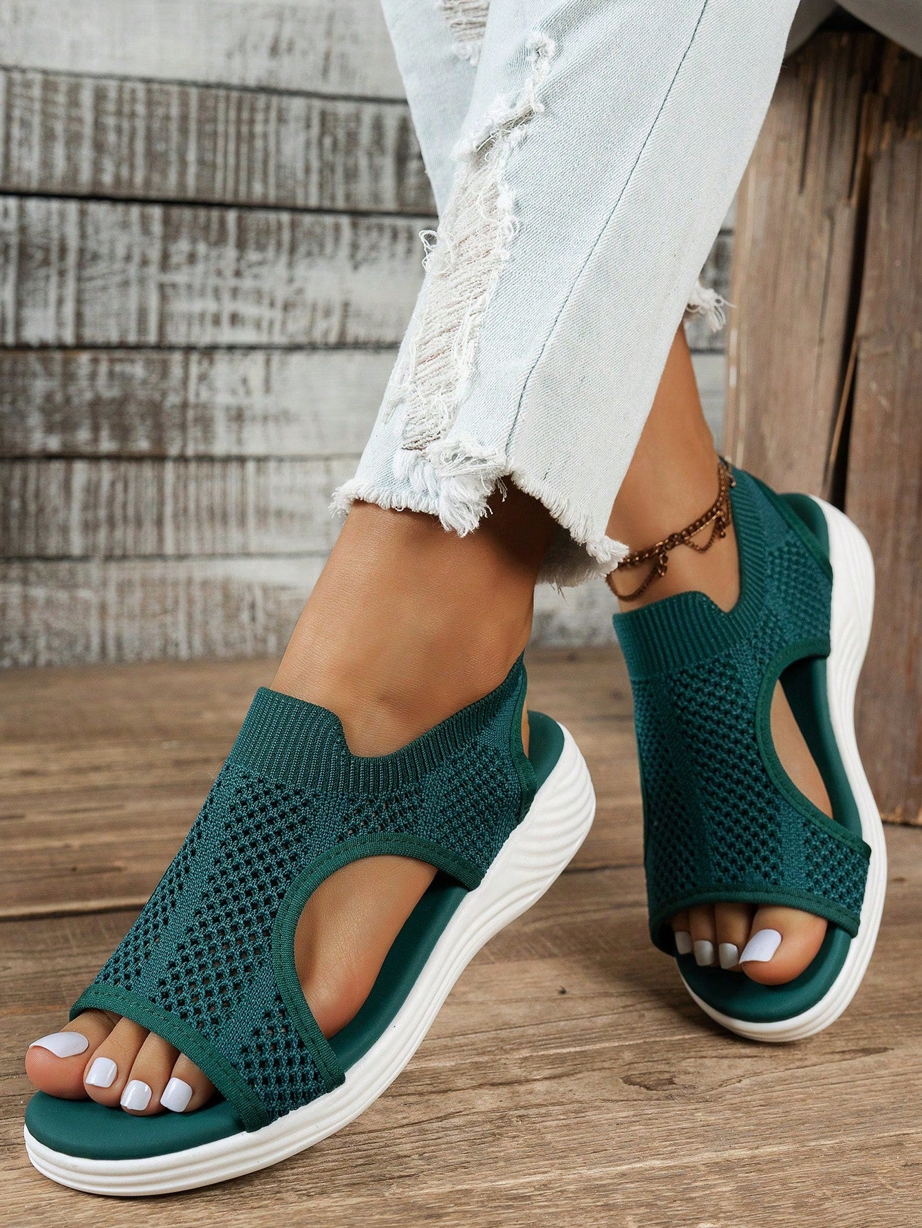 Plus size women's slip-on wedge slide sandals with open toe, low platform heel, and breathable cutout fabric upper, shown as a casual outdoor style sandal.