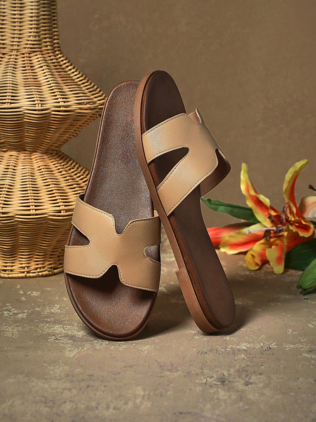 Women's flat slide sandals with supportive PU midsole, harness-style cutout detail, and open toe design.