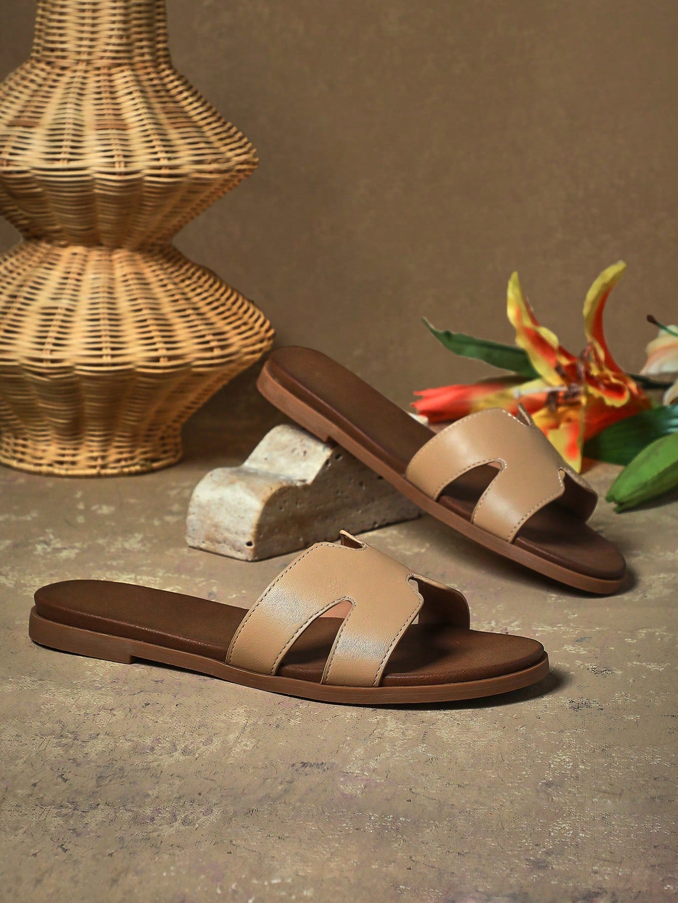 Women's flat slide sandals with supportive PU midsole, harness-style cutout detail, and open toe design.