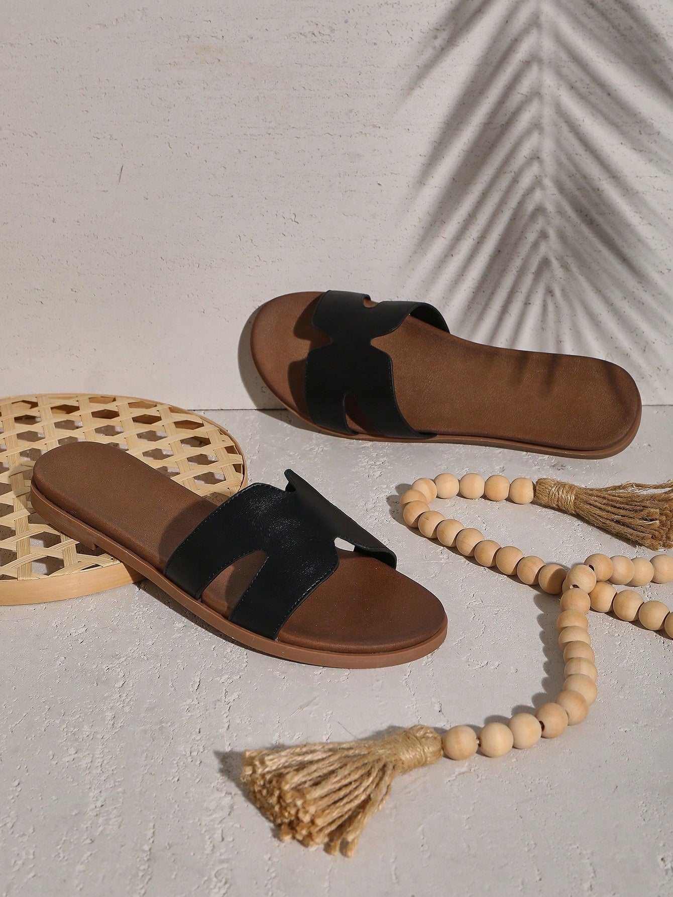 Women's flat slide sandals with supportive PU midsole, harness-style cutout detail, and open toe design.