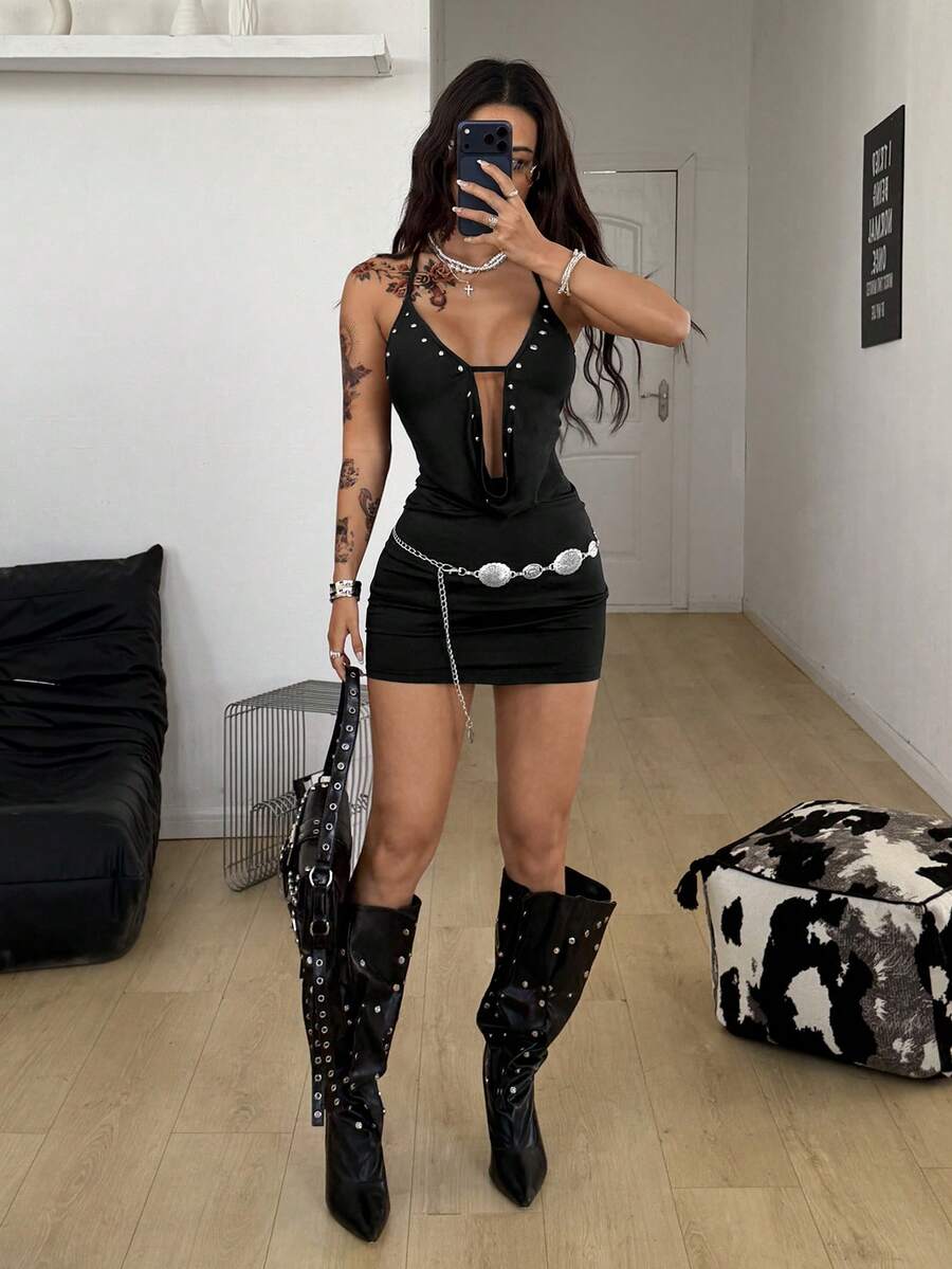 Women's sleeveless halter cowl neck mini bodycon dress with backless knot detail and grommet eyelet accents