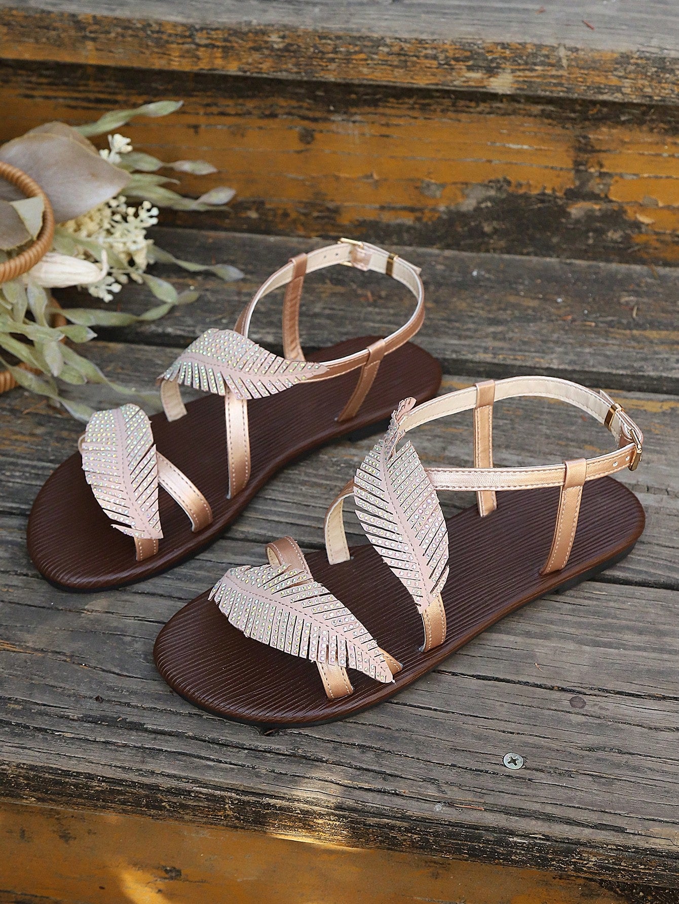 Women's flat sandals with strappy rope-detail design, plant pattern, and open-toe silhouette.