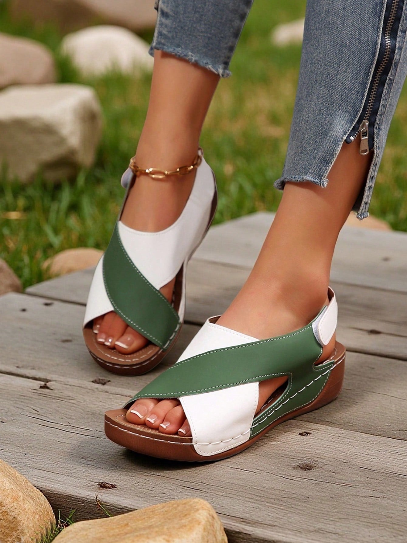 Women's color block platform flat sandals with open toe, criss-cross straps, and hook-loop closure, featuring a low heel thick sole design for casual vacation wear.