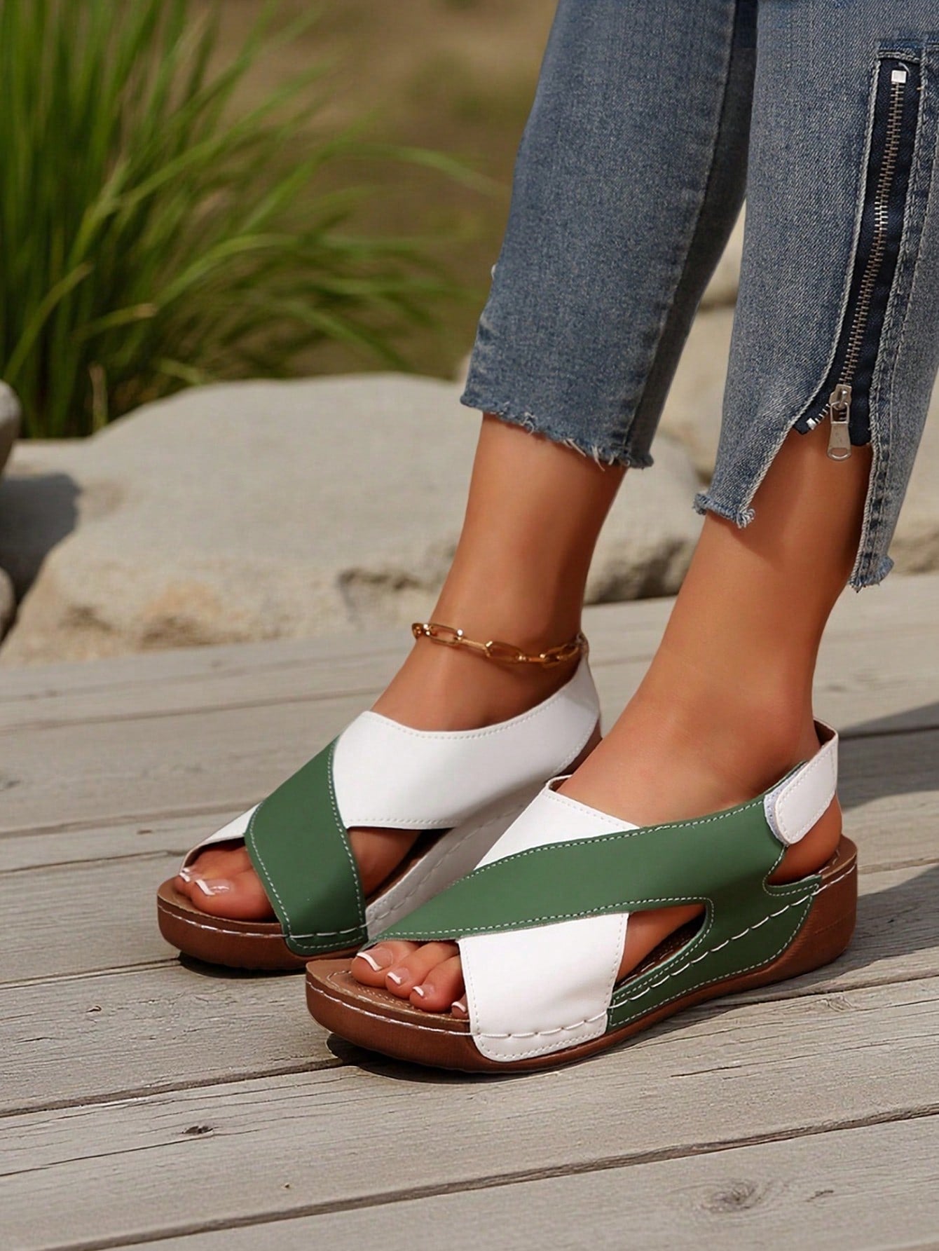 Women's color block platform flat sandals with open toe, criss-cross straps, and hook-loop closure, featuring a low heel thick sole design for casual vacation wear.