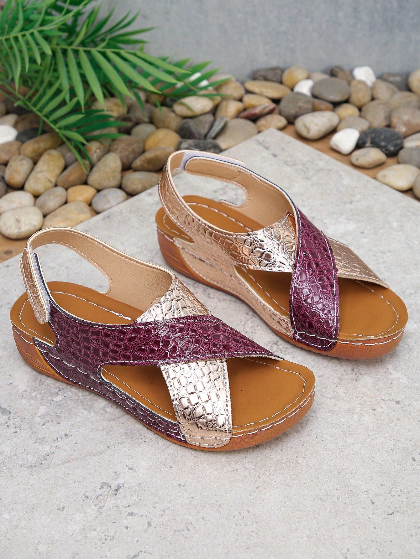 Pair of women’s plus size platform wedge sandals with round toe, criss-cross straps, hook-and-loop Velcro closure, and textured crocodile-embossed PU upper, designed for beach and vacation wear.