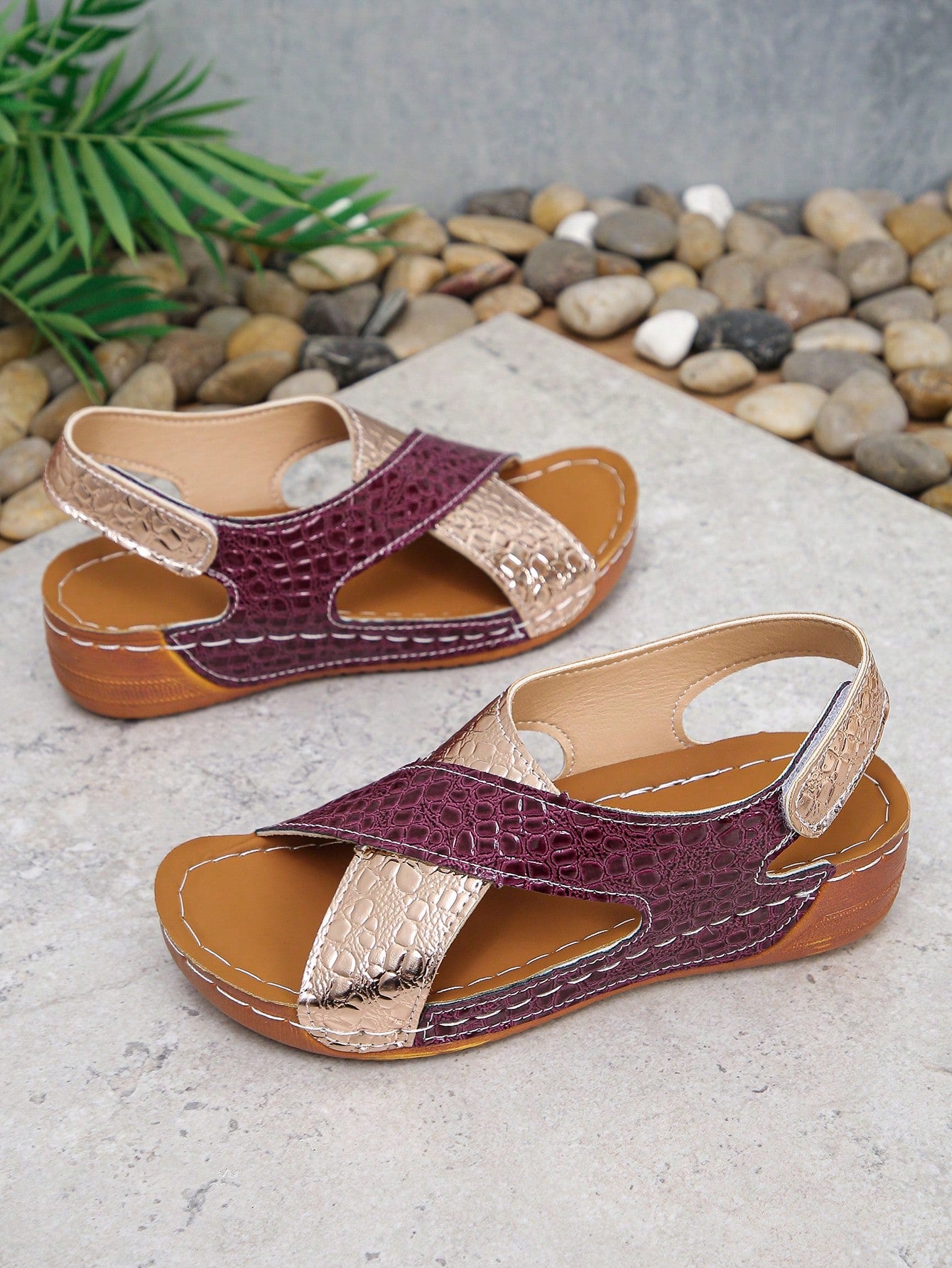 Pair of women’s plus size platform wedge sandals with round toe, criss-cross straps, hook-and-loop Velcro closure, and textured crocodile-embossed PU upper, designed for beach and vacation wear.