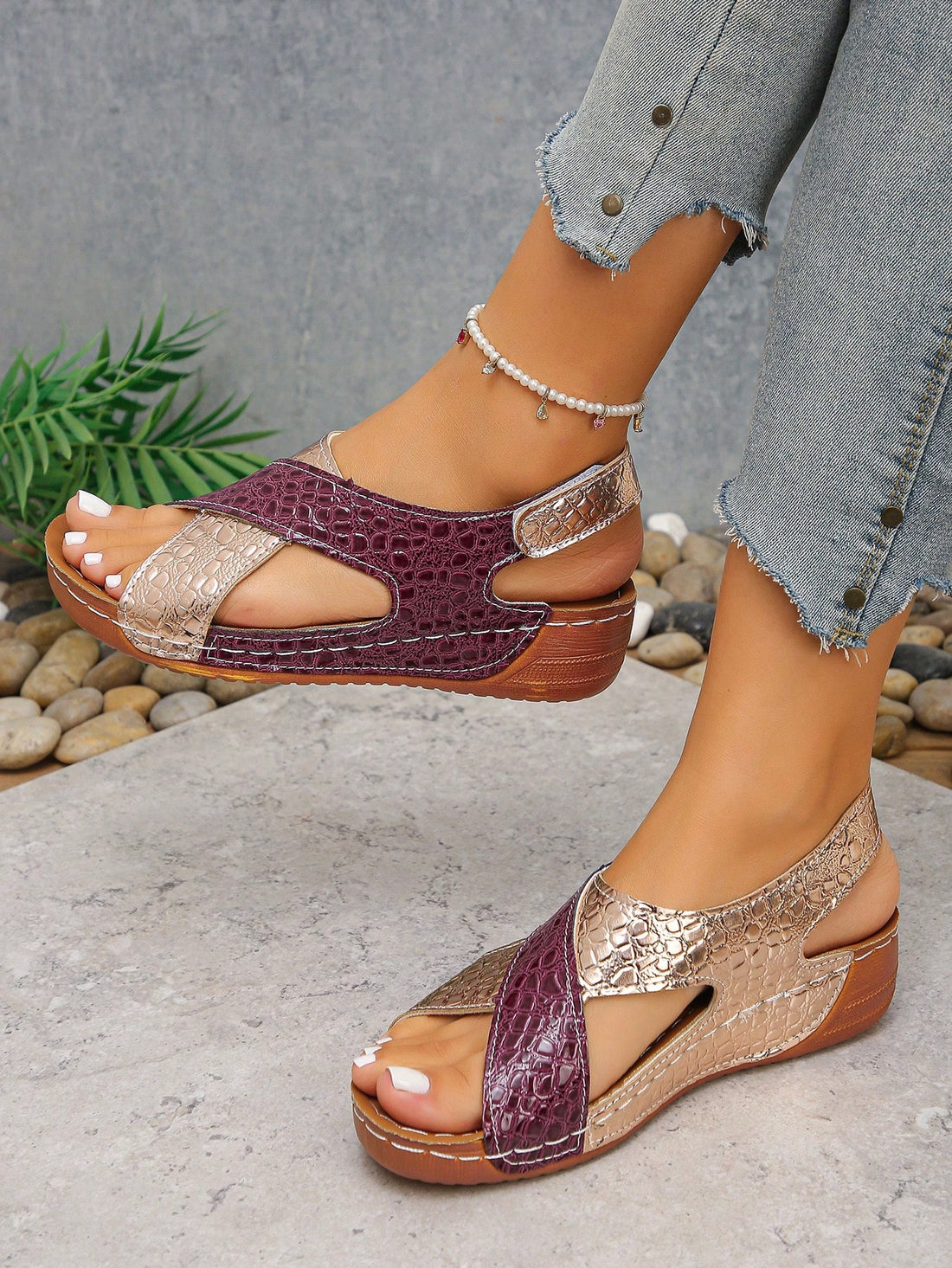 Pair of women’s plus size platform wedge sandals with round toe, criss-cross straps, hook-and-loop Velcro closure, and textured crocodile-embossed PU upper, designed for beach and vacation wear.