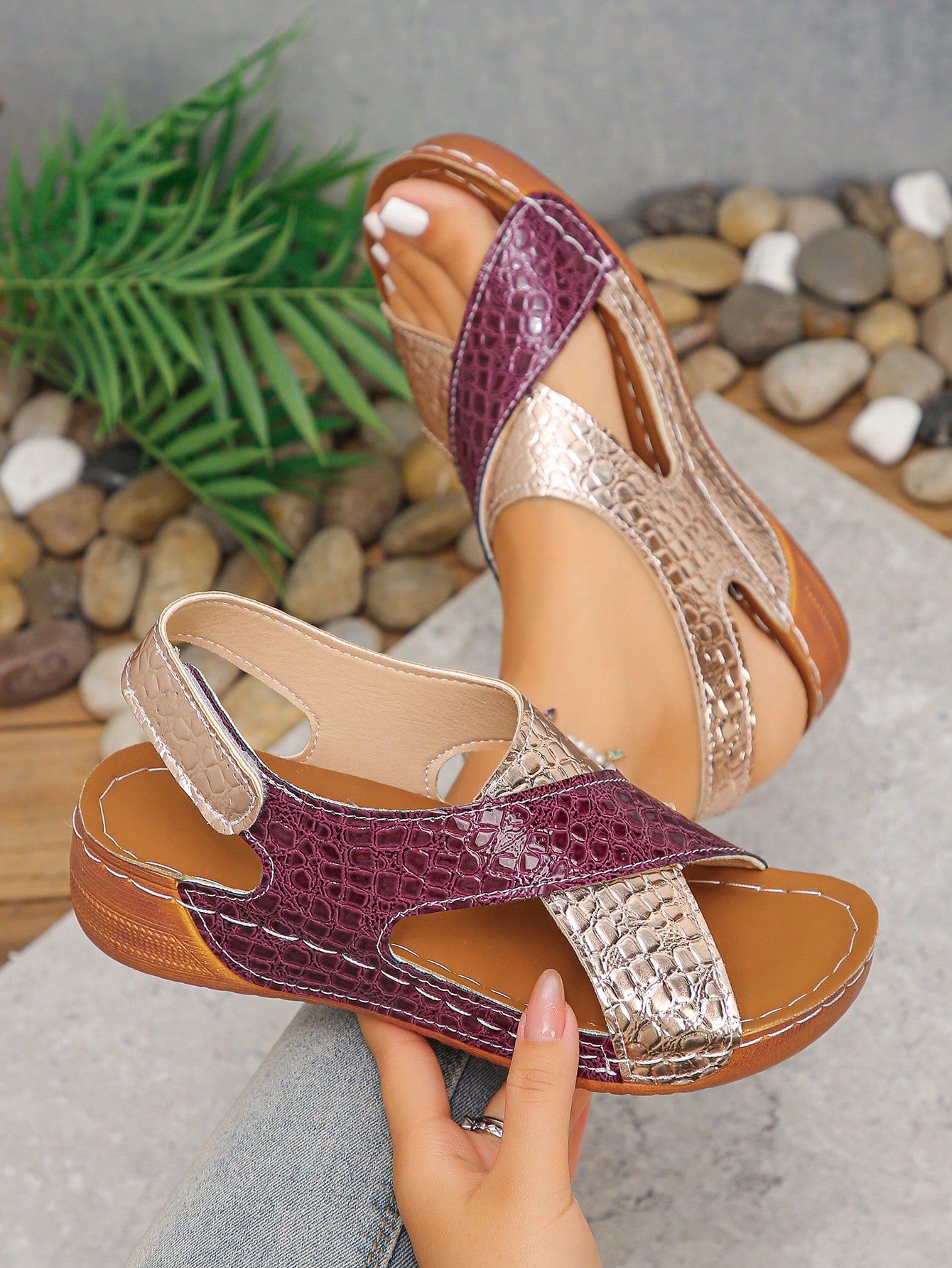 Pair of women’s plus size platform wedge sandals with round toe, criss-cross straps, hook-and-loop Velcro closure, and textured crocodile-embossed PU upper, designed for beach and vacation wear.