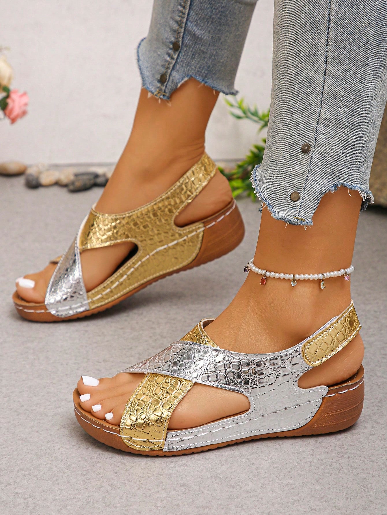 Pair of women’s plus size platform wedge sandals with round toe, criss-cross straps, hook-and-loop Velcro closure, and textured crocodile-embossed PU upper, designed for beach and vacation wear.