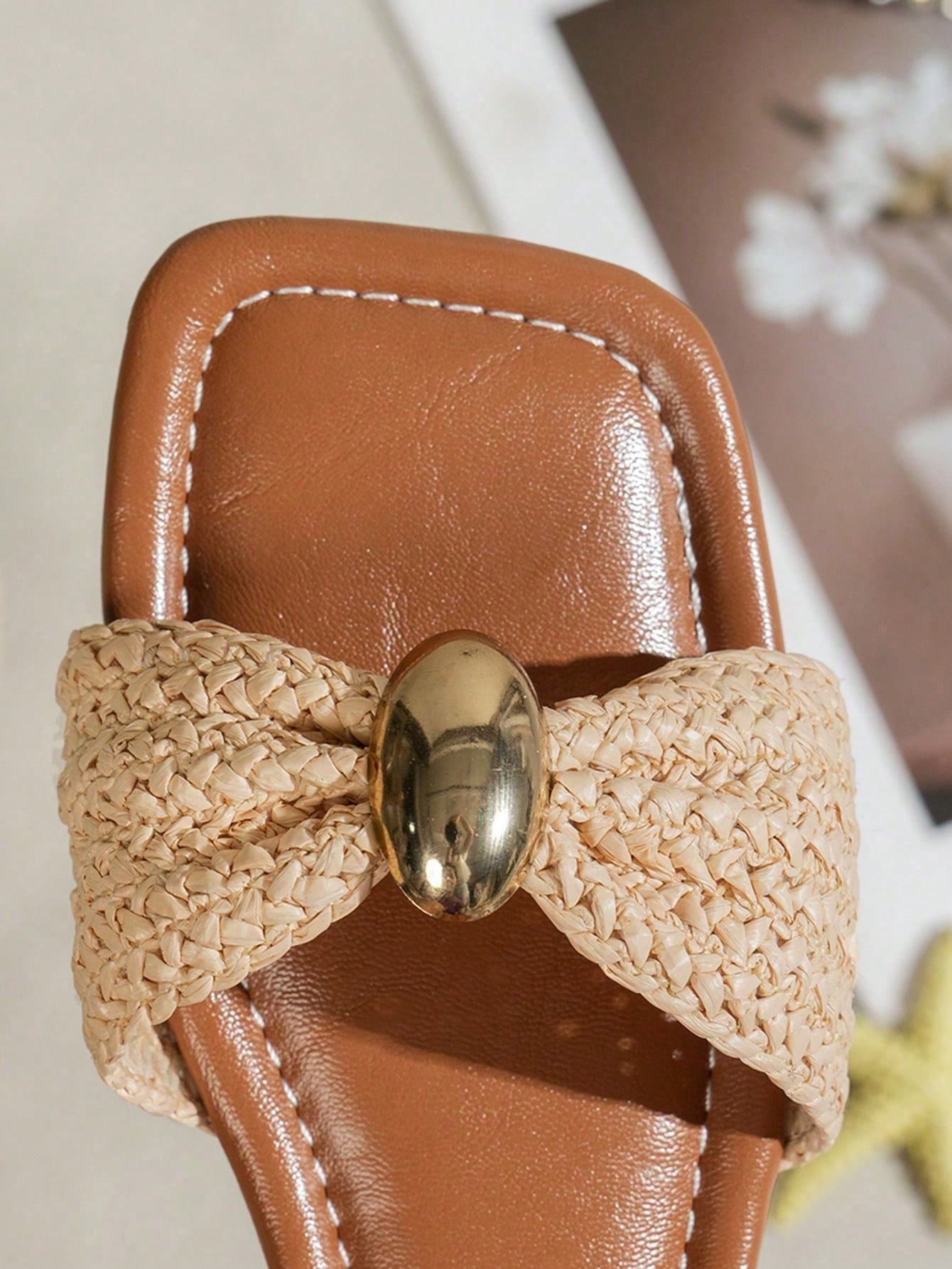 Women's ginger woven flat slide sandals with open toe, bow knot detail, and metal decor in a minimalist beach style.
