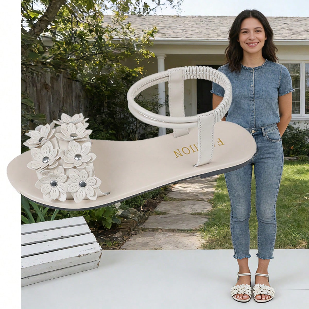 Women's beige flat sandals with stitched flower petal detail, open toe front, and adjustable ankle strap for casual warm-weather and beach wear.