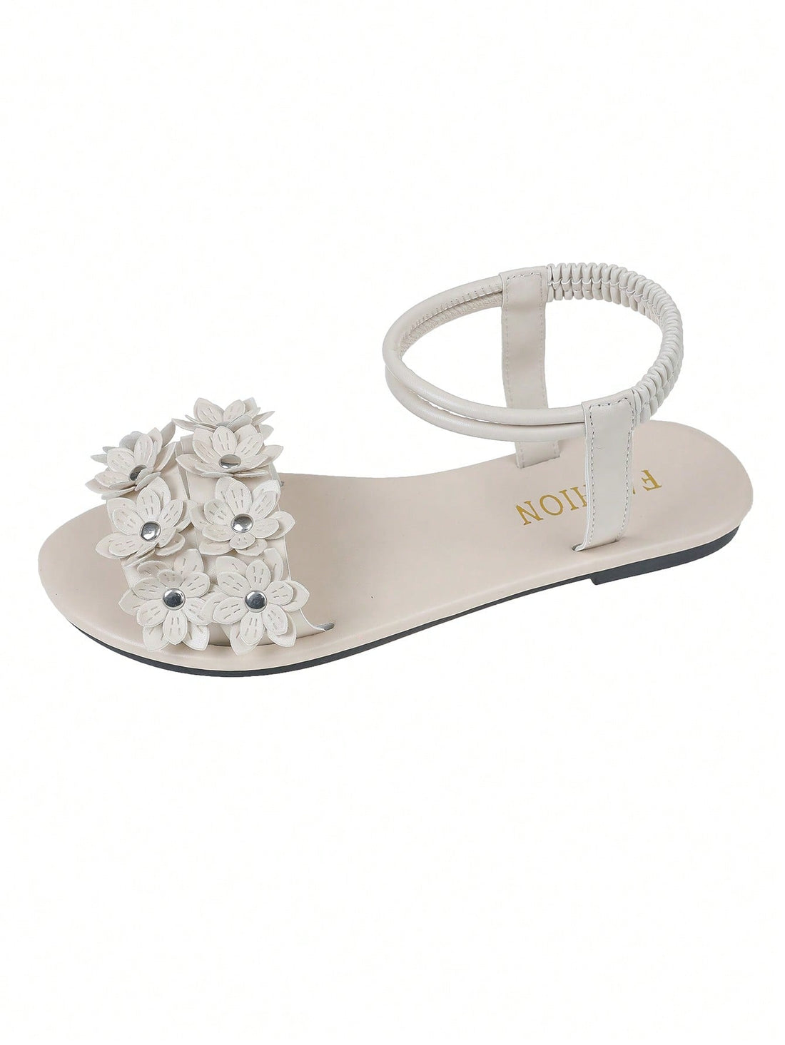 Women's beige flat sandals with stitched flower petal detail, open toe front, and adjustable ankle strap for casual warm-weather and beach wear.