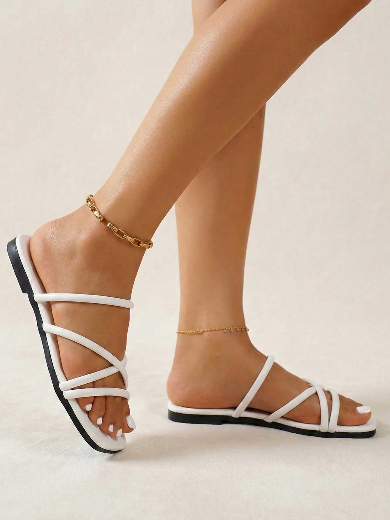 Women’s open-toe slip-on flat slide sandals featuring a textured stone-pattern asymmetrical stripe design for casual daily and summer beach wear.