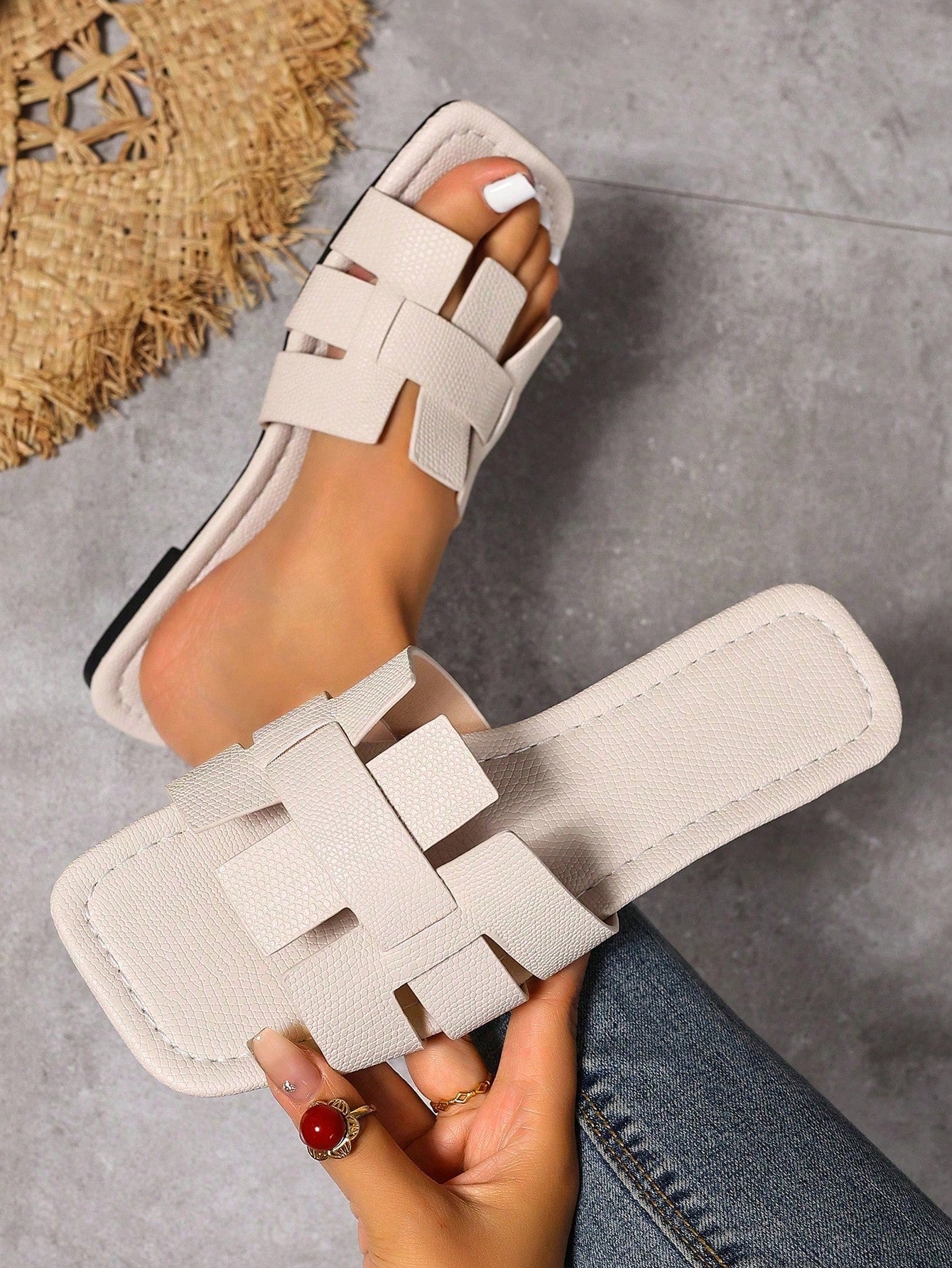 Women's Korean-style casual flat slide sandals with open toe, geometric detail, and pink color.