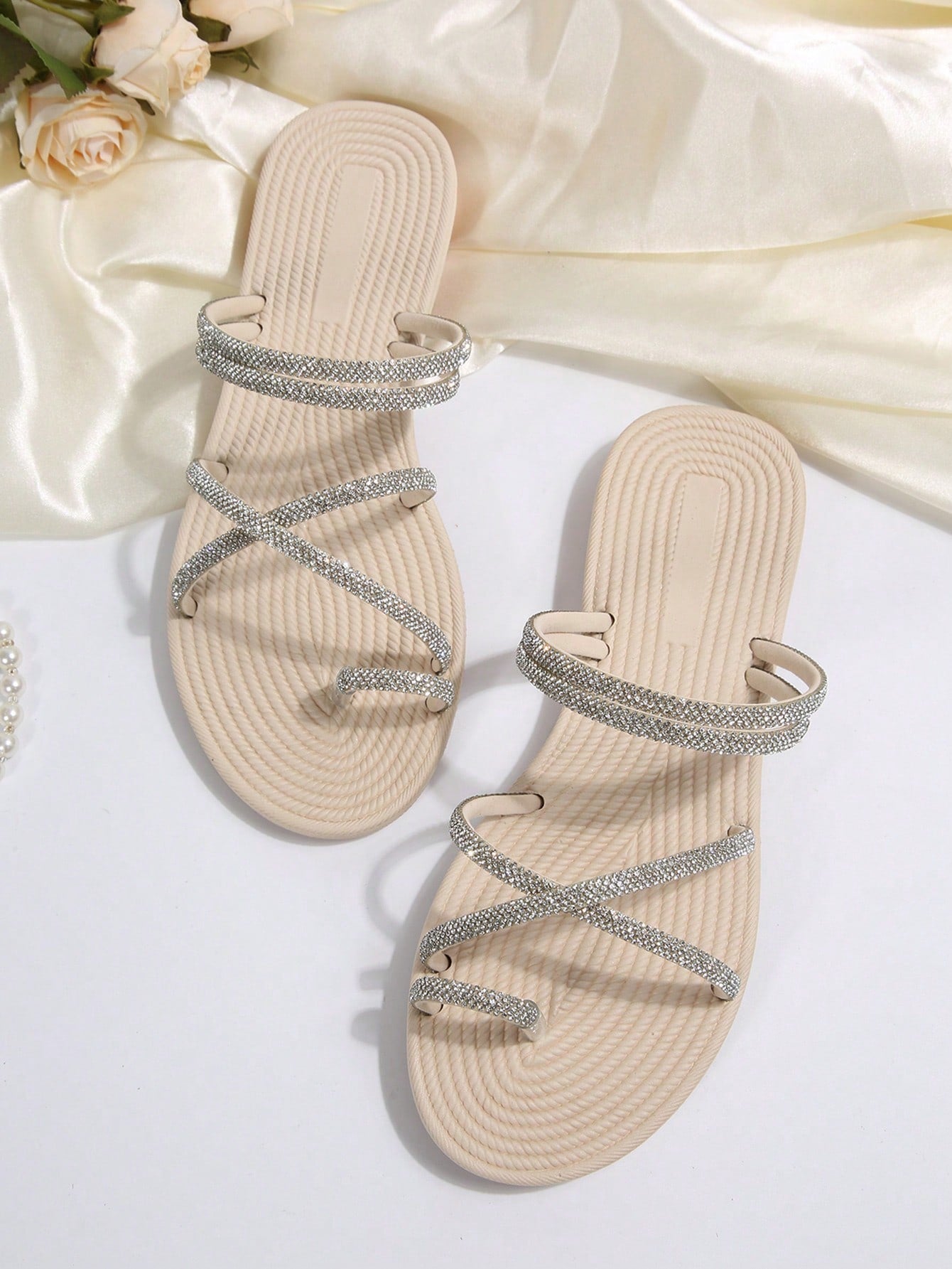 Women's open-toe strappy flat sandals with tasseled upper, seashell-inspired decoration, and rhinestone detail, designed for lightweight, comfortable beach and casual indoor or outdoor wear.
