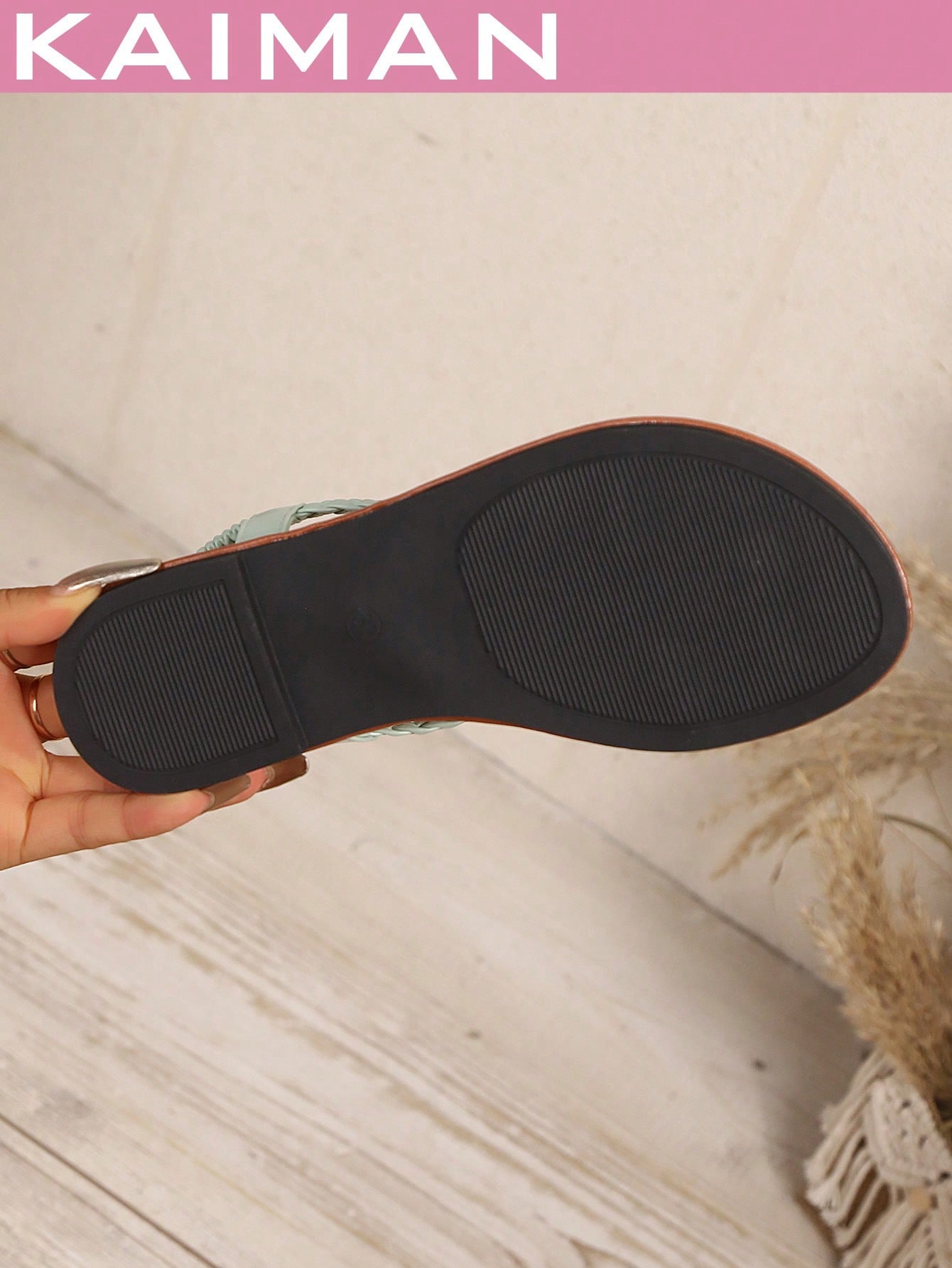 Open-toe flat slide sandals featuring rhinestone leaf decoration in a vacation-inspired style.