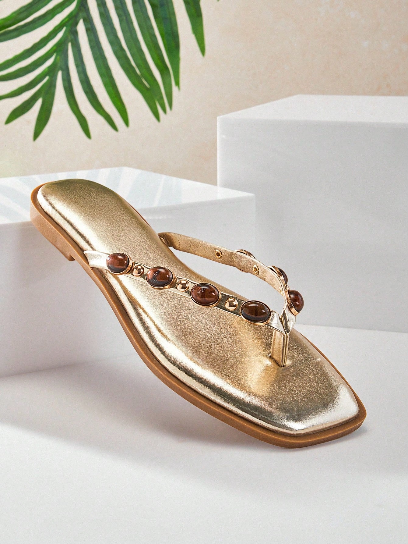 Women's gold metallic PU flip-flop thong sandals with square toe, toe-post front, and tiger eye gemstone decor with turquoise texture detail.