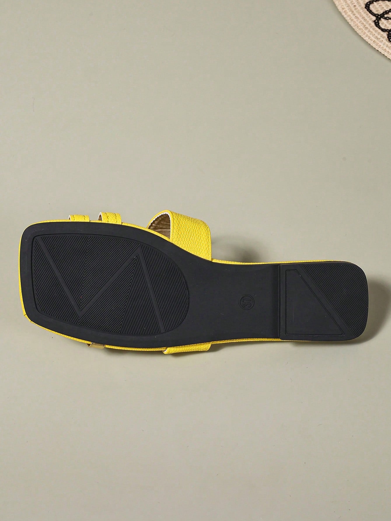 Women's yellow open-toe flat slide sandals featuring a cut-out design and textured plain pattern for casual beach and daily wear.