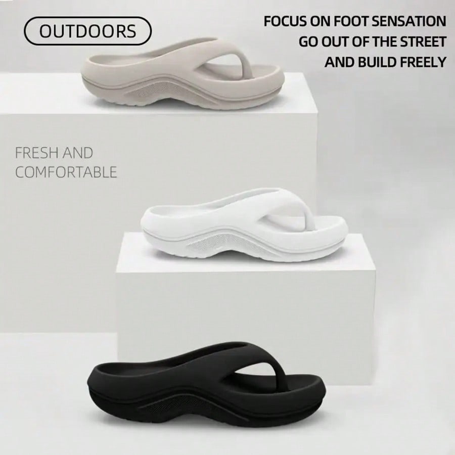 Pair of ultra-soft cloud flip flops with arch support, toe-post thong design, flat sole, and textured plain upper for beach, indoor, and outdoor use.