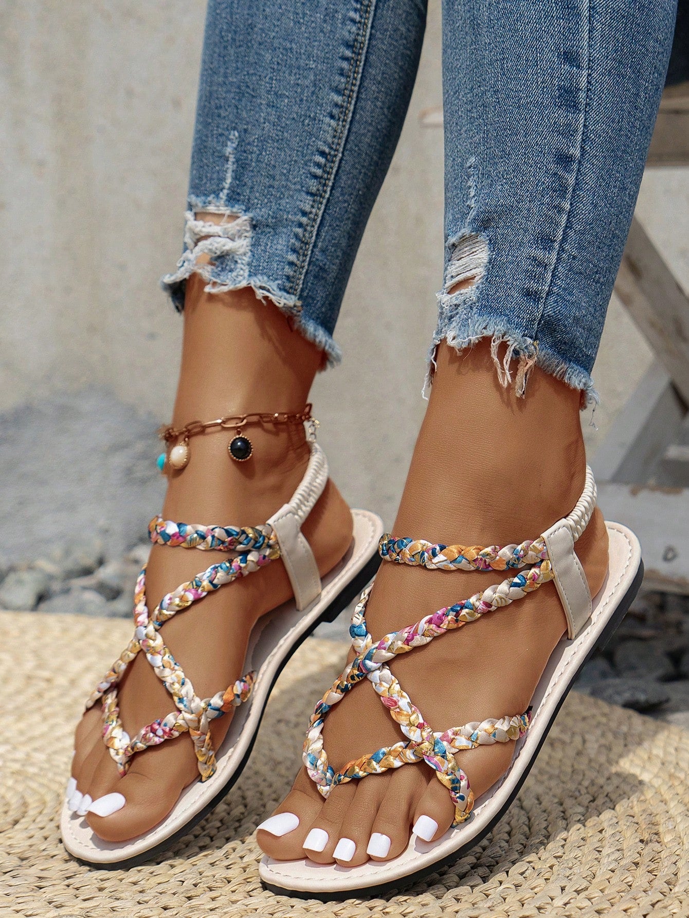 Women’s leopard print woven strap Roman-style flat slide sandals with toe post and cut-out detail.