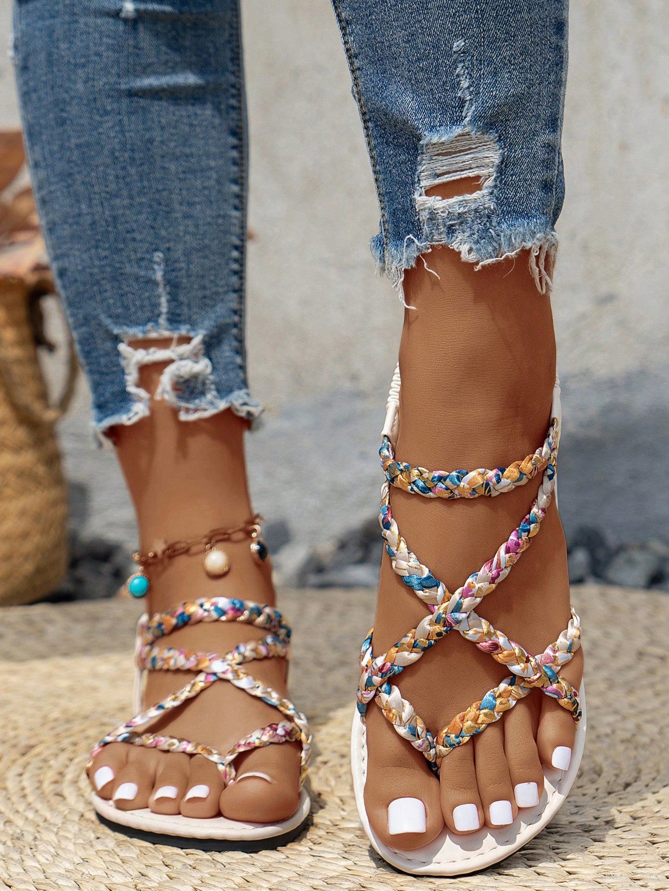 Women’s leopard print woven strap Roman-style flat slide sandals with toe post and cut-out detail.