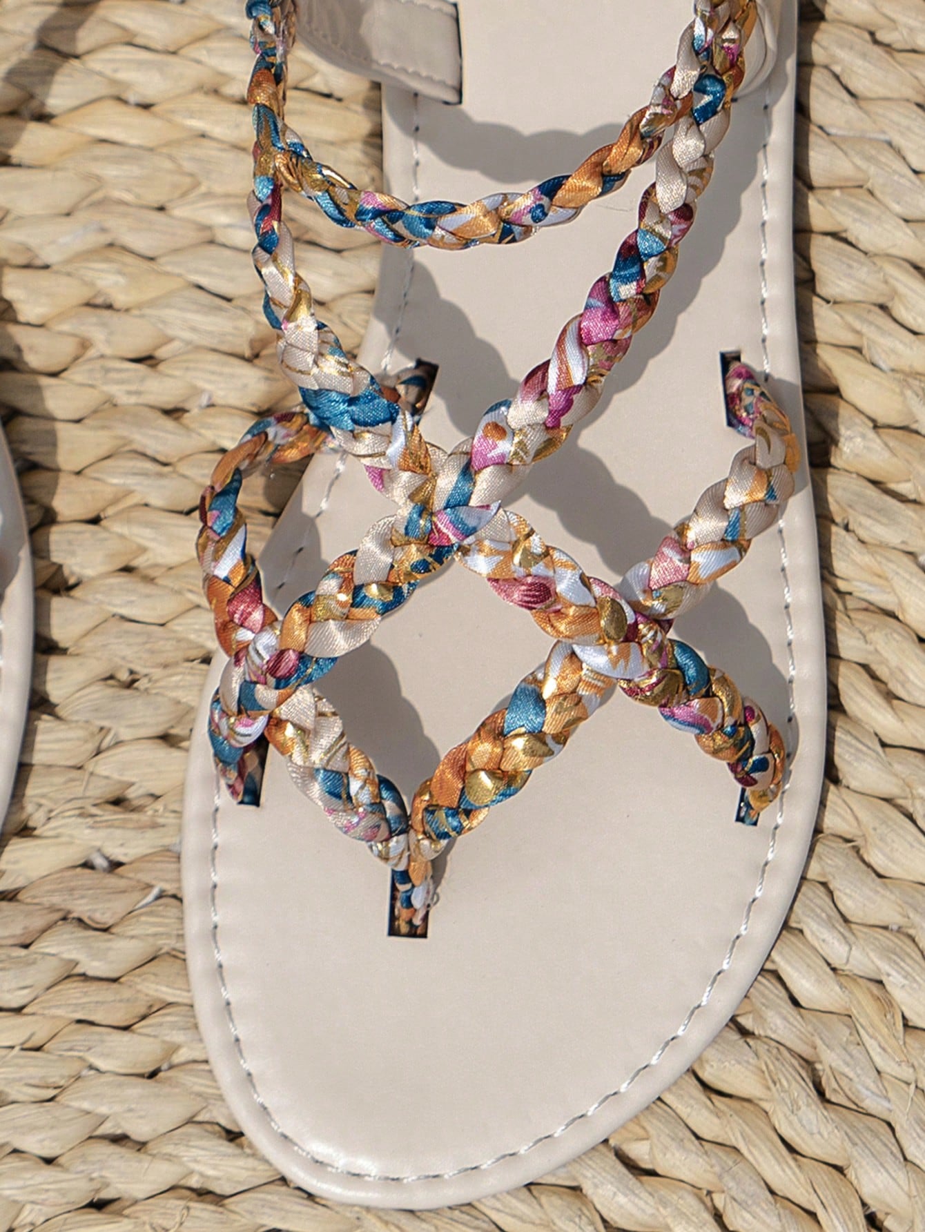 Women’s leopard print woven strap Roman-style flat slide sandals with toe post and cut-out detail.