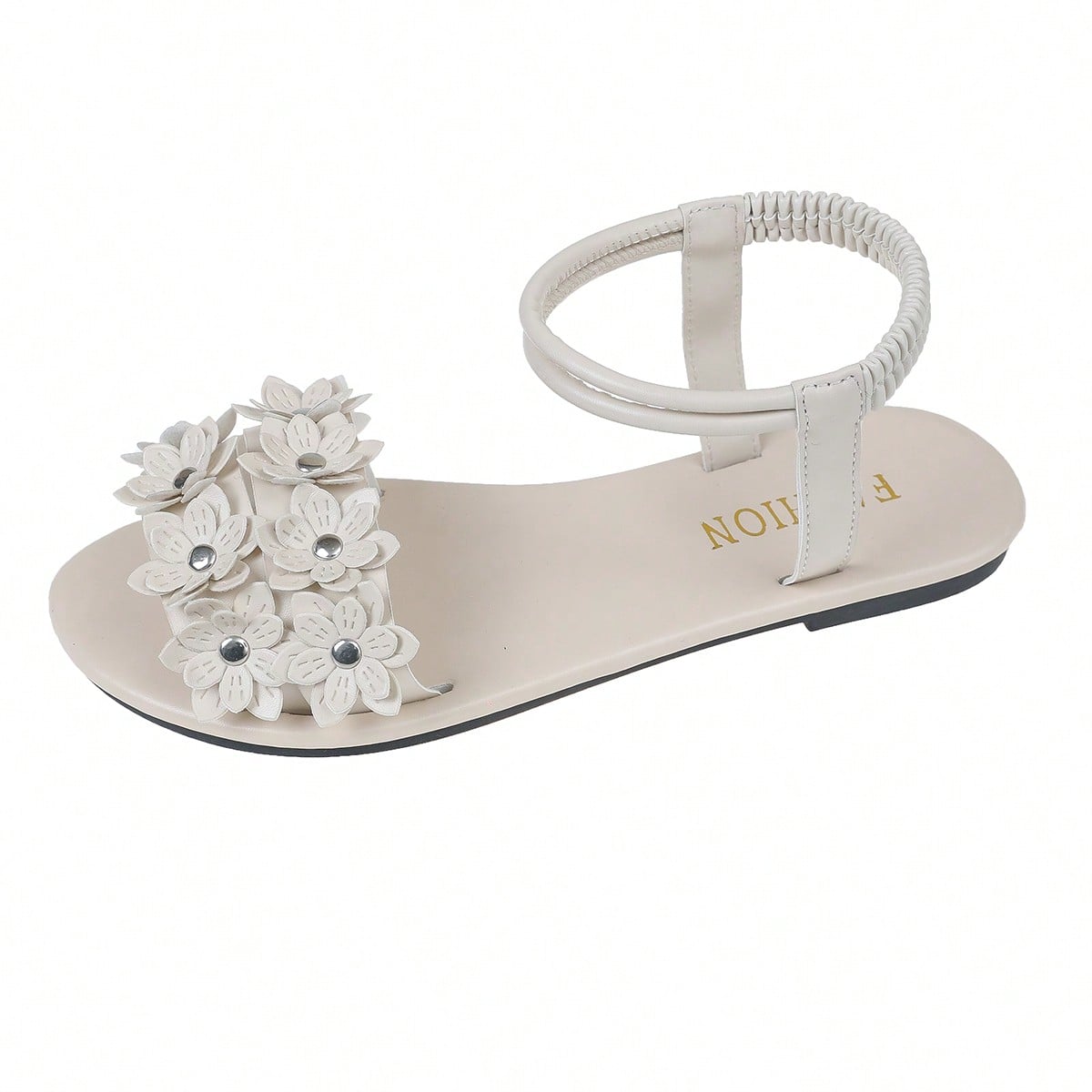 Women's beige flat sandals with stitched flower petal detail, open toe front, and adjustable ankle strap for casual warm-weather and beach wear.